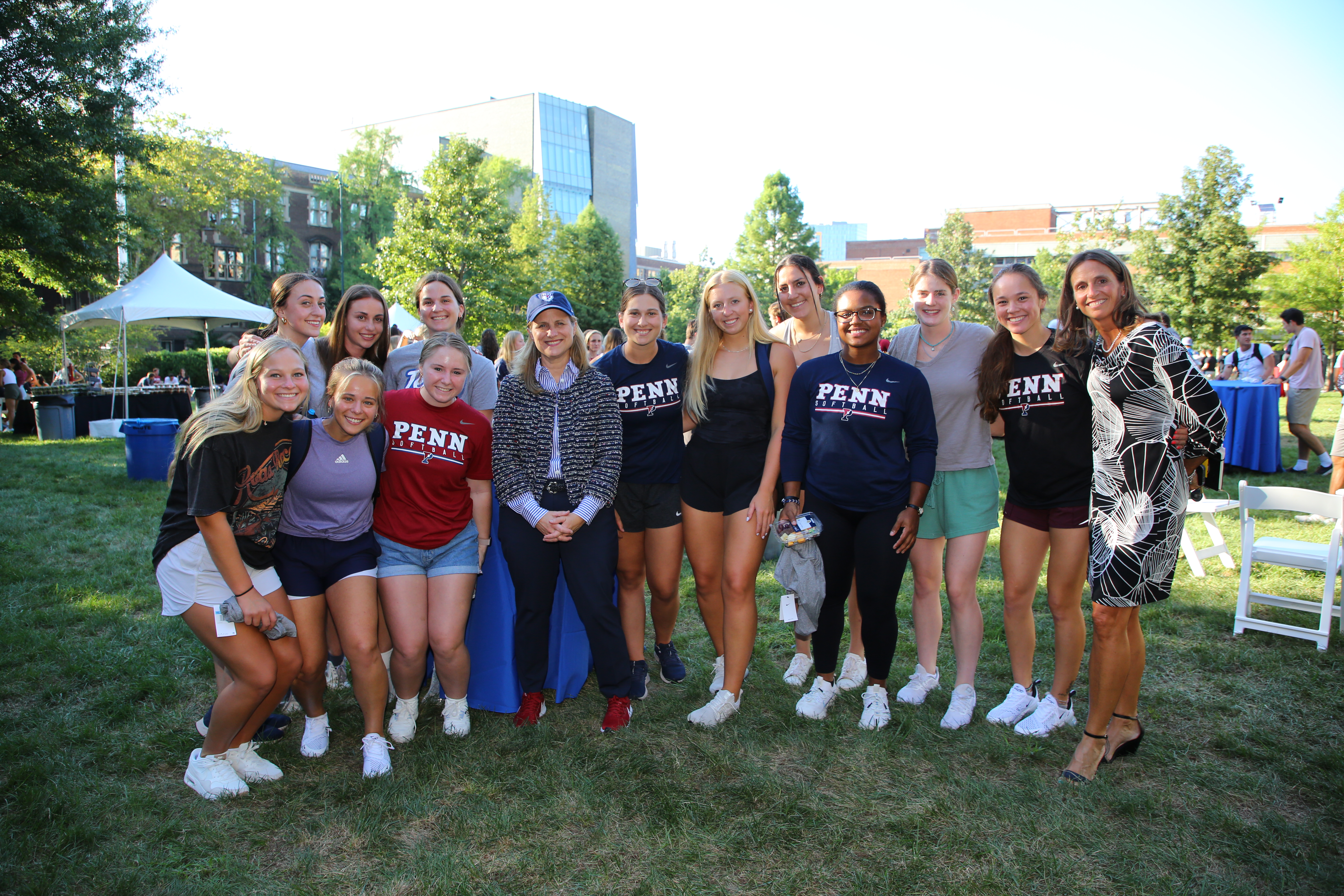 Penn students pose with President Magill and AD Shanahan.
