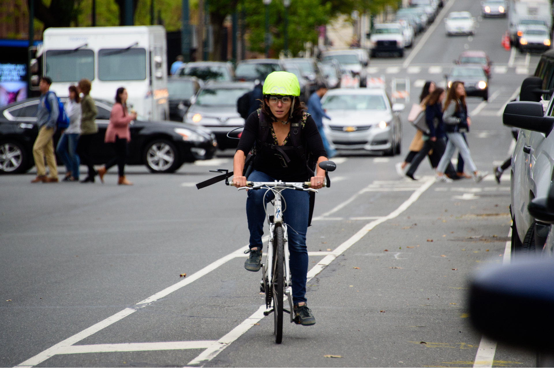 megan ryerson cycling down a city bike lane