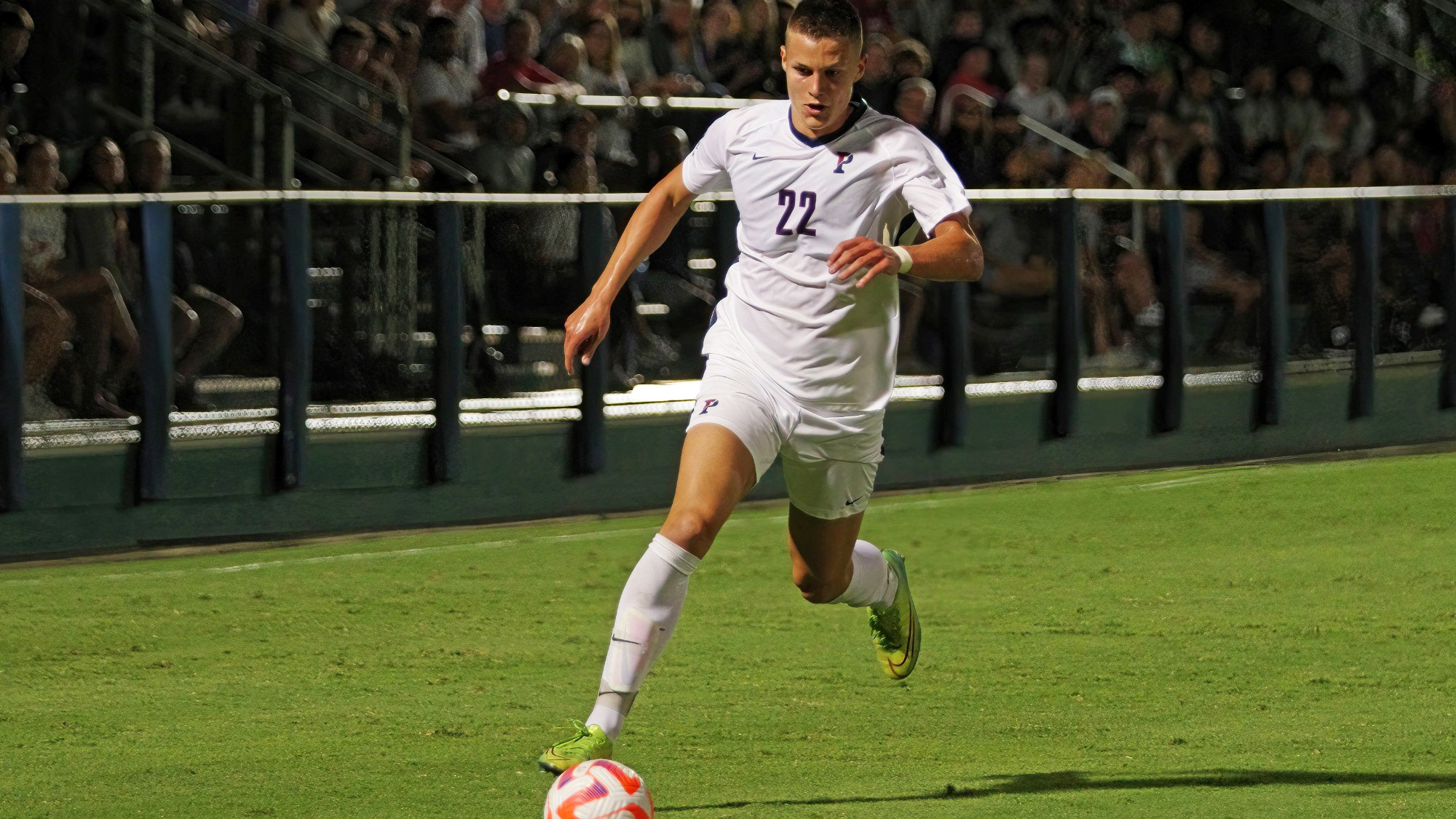  Stas Korzeniowski dribbles the ball down the field.