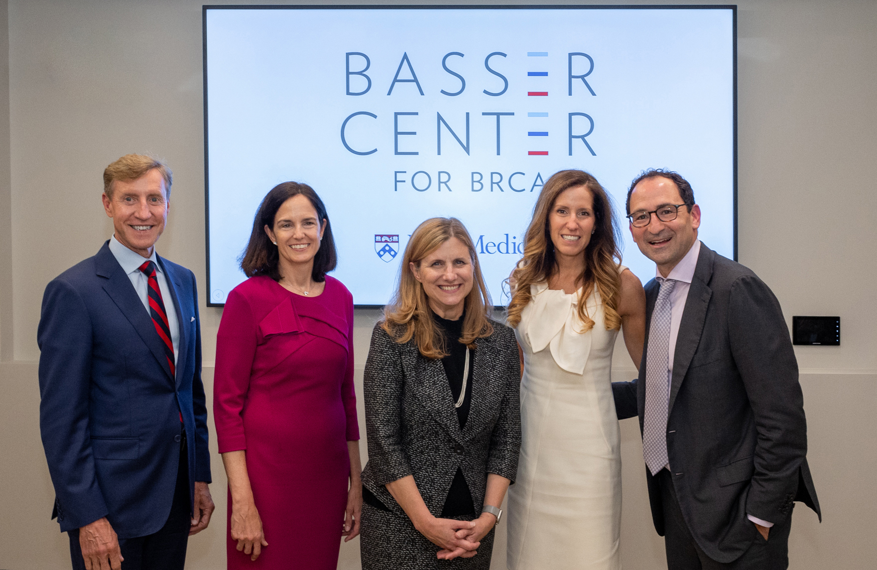 J. Larry Jameson, Susan Domcheck, Liz Magill, Mindy Gray, and Jon Gray in front of a sign that reads Basser Center for BRCA.