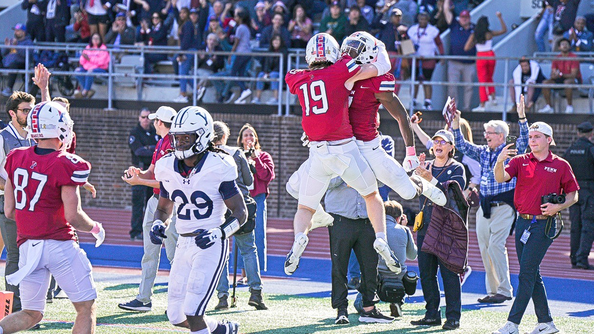 Fourth-year wide receiver Malone Howley (No. 19) celebrates with a teammate during Penn’s 20-13 win over Yale on Saturday at Franklin Field. 