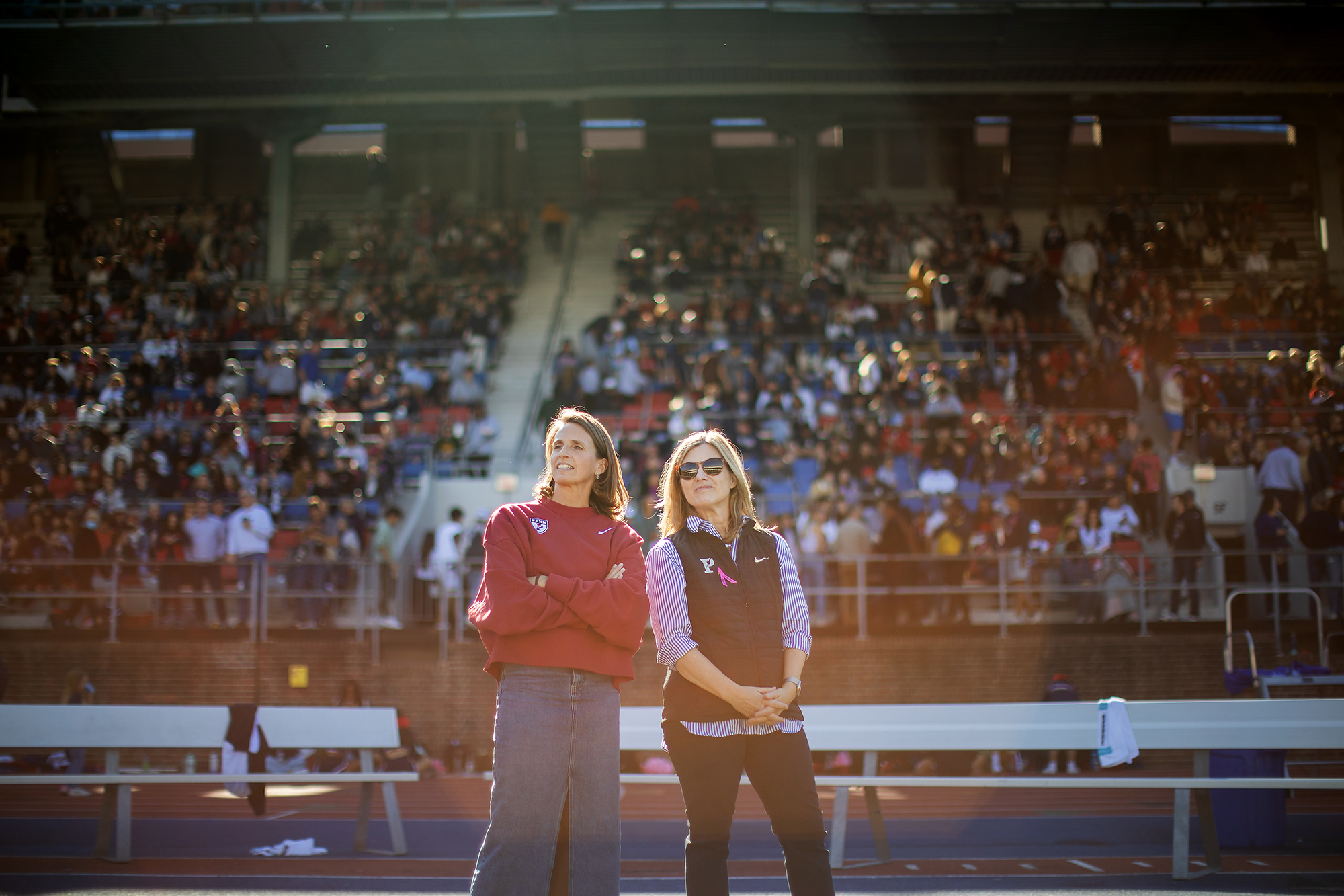 AD Alanna Shanahan and President Liz Magill take in the game from the sidelines.