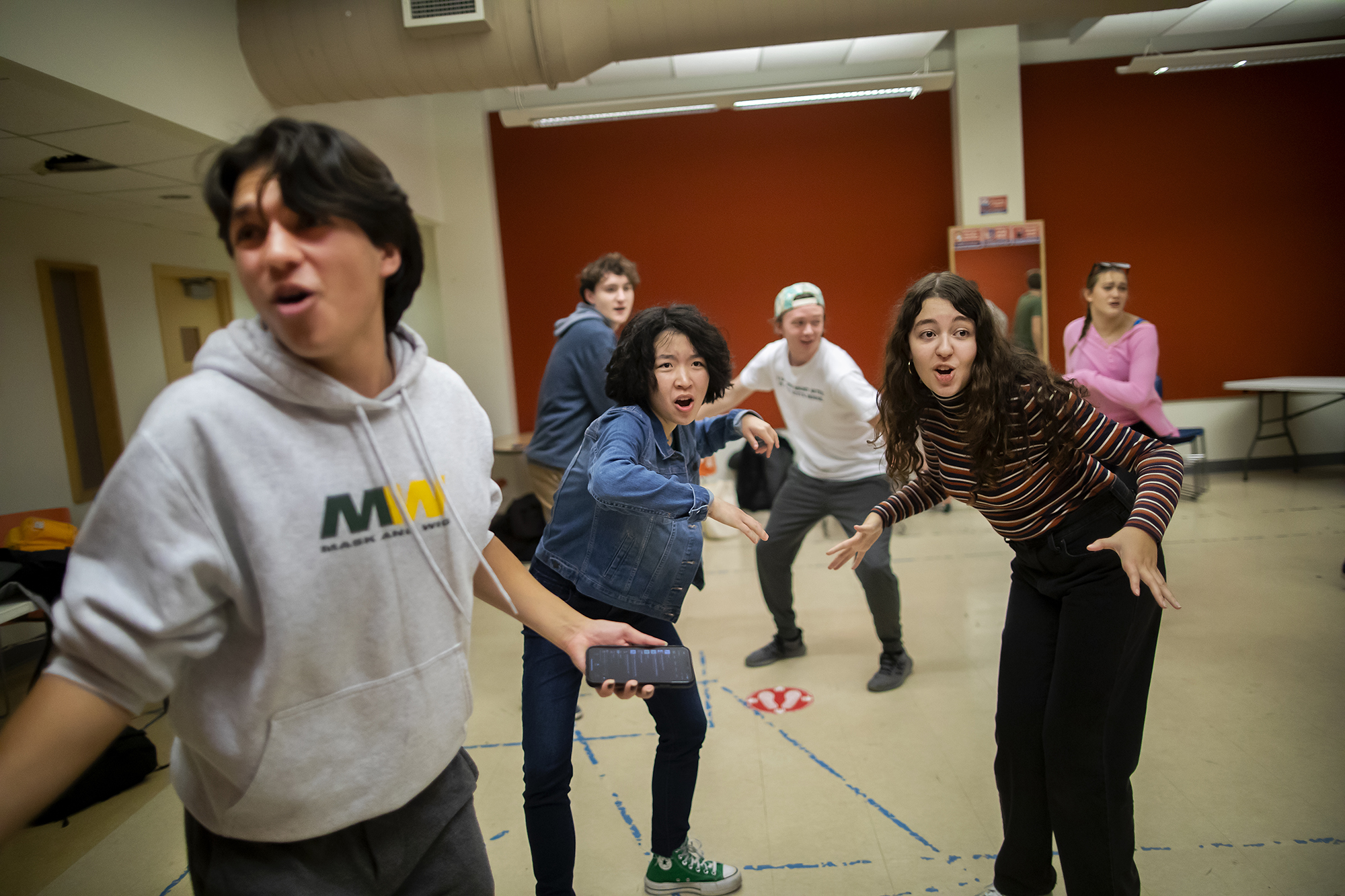 six students dancing in a rehearsal room