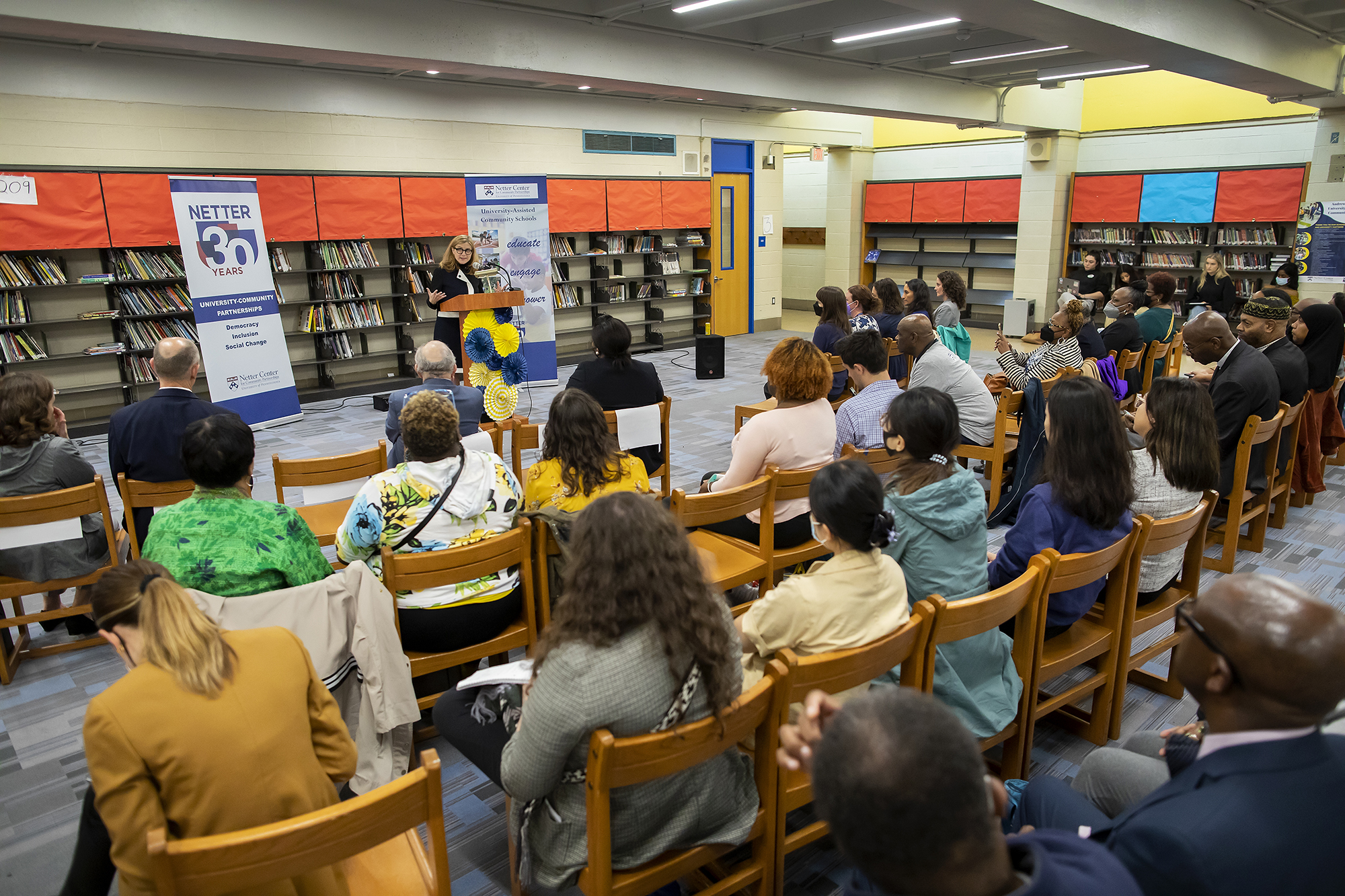 wide angle view of penn president liz magill at hamilton school podium