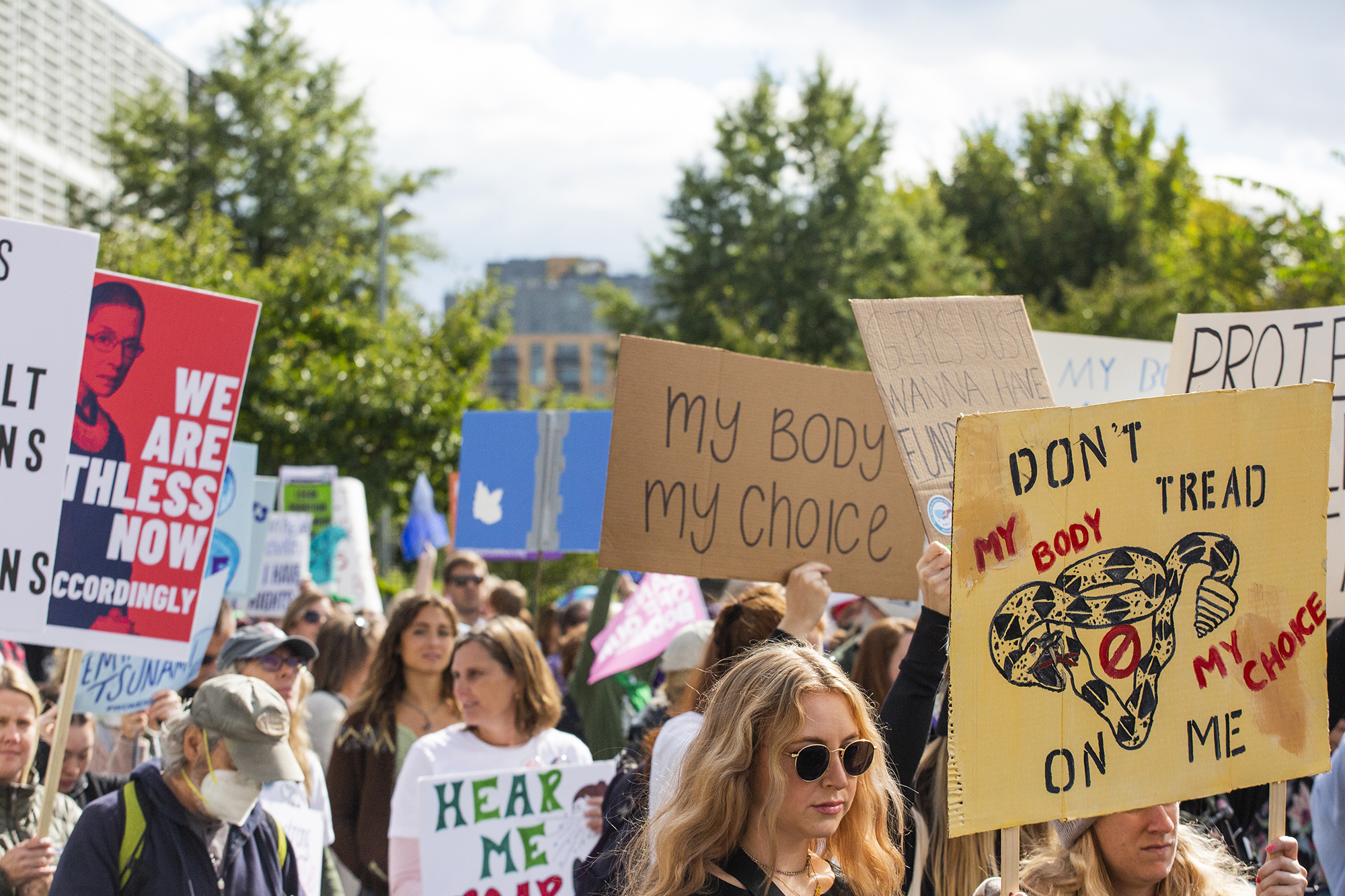 Demonstrators at the Women’s March in October 2022 holding up pro-choice signs.