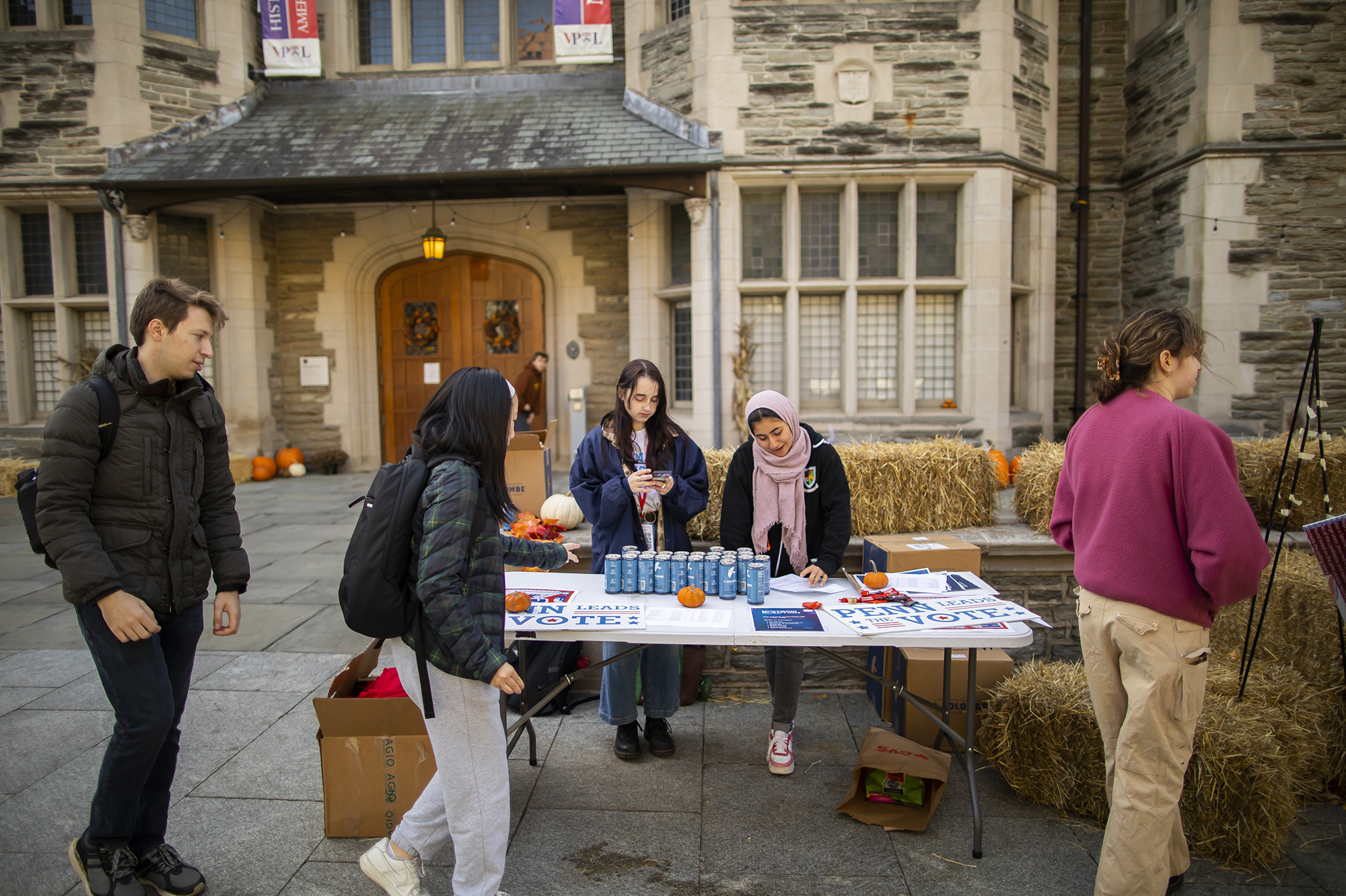 Members of Penn Leads the Vote at a table outside Houston Hall on Election Day.