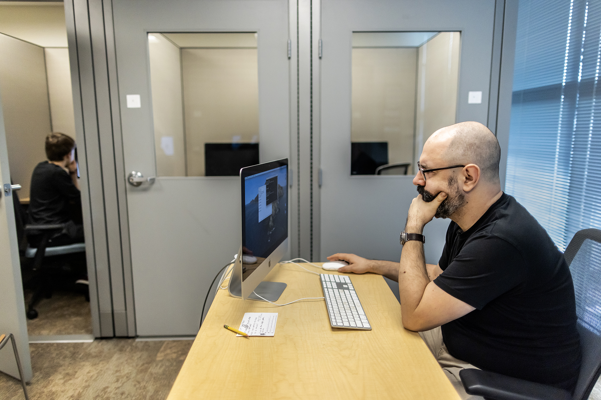 Gareth Roberts at a computer in a language lab.