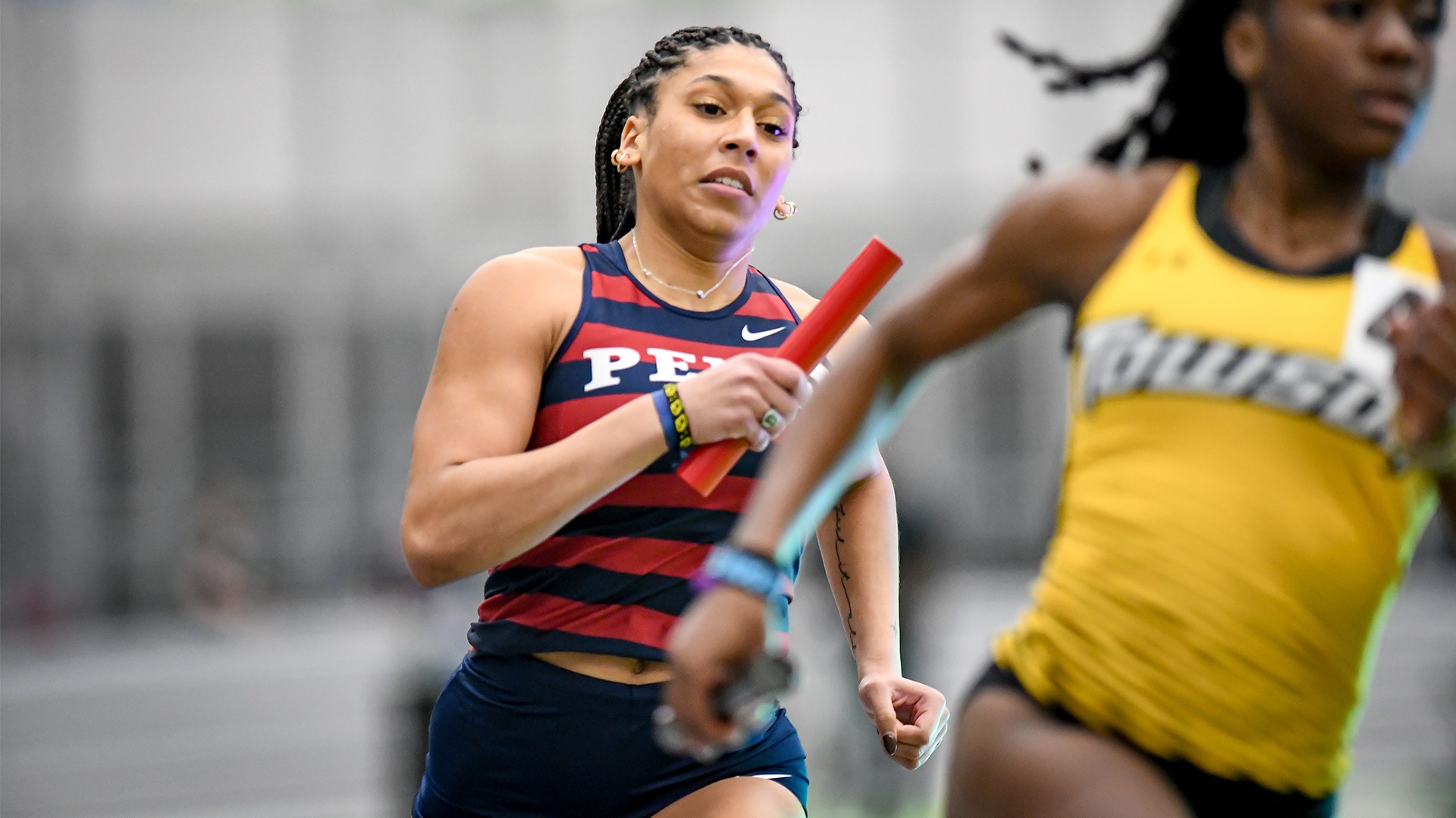  Whittaker, running with a baton in her hand behind a Towson athlete, sprinted the eighth-fastest time in school history.