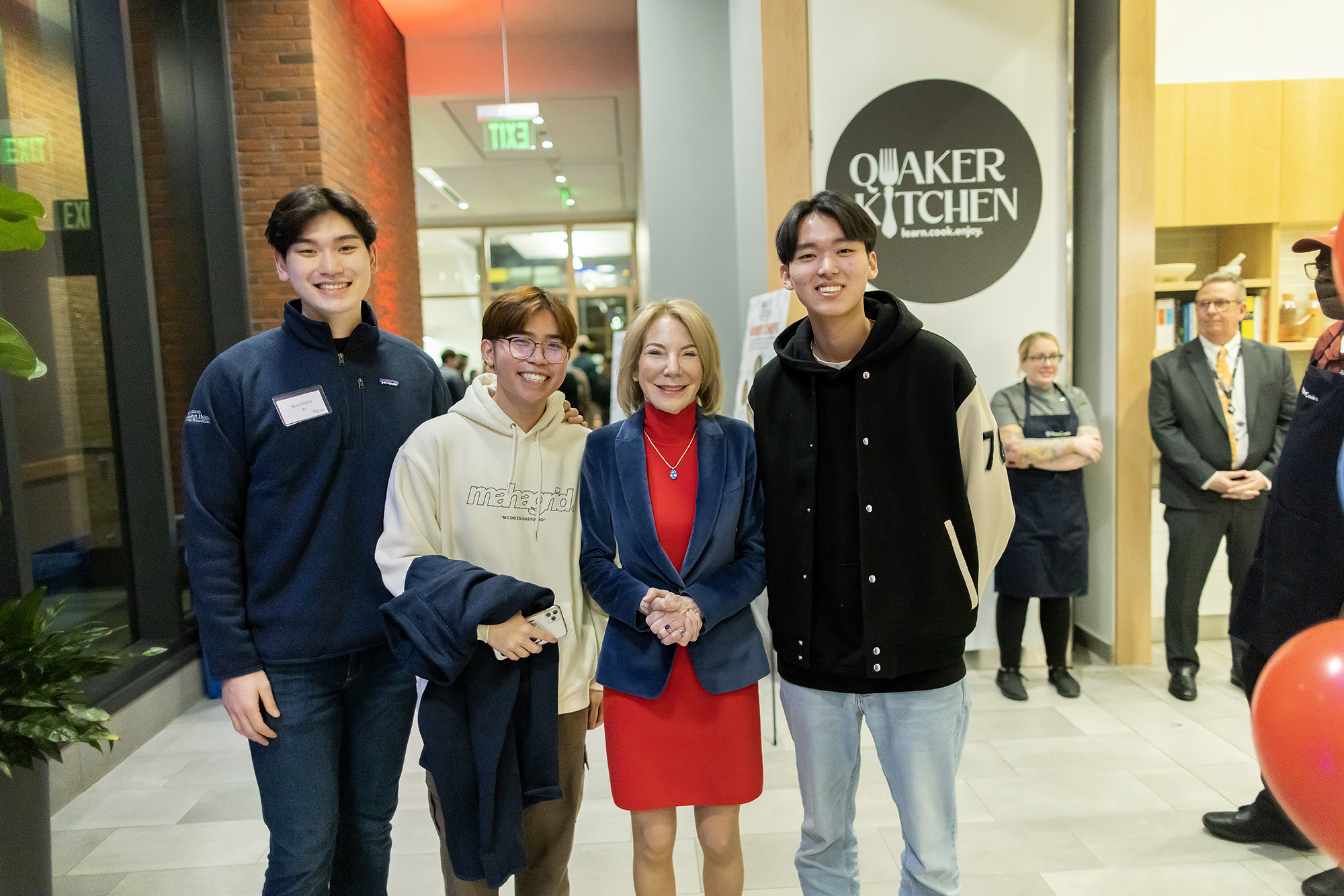 Gutmann with students in front of Quaker Kitchen