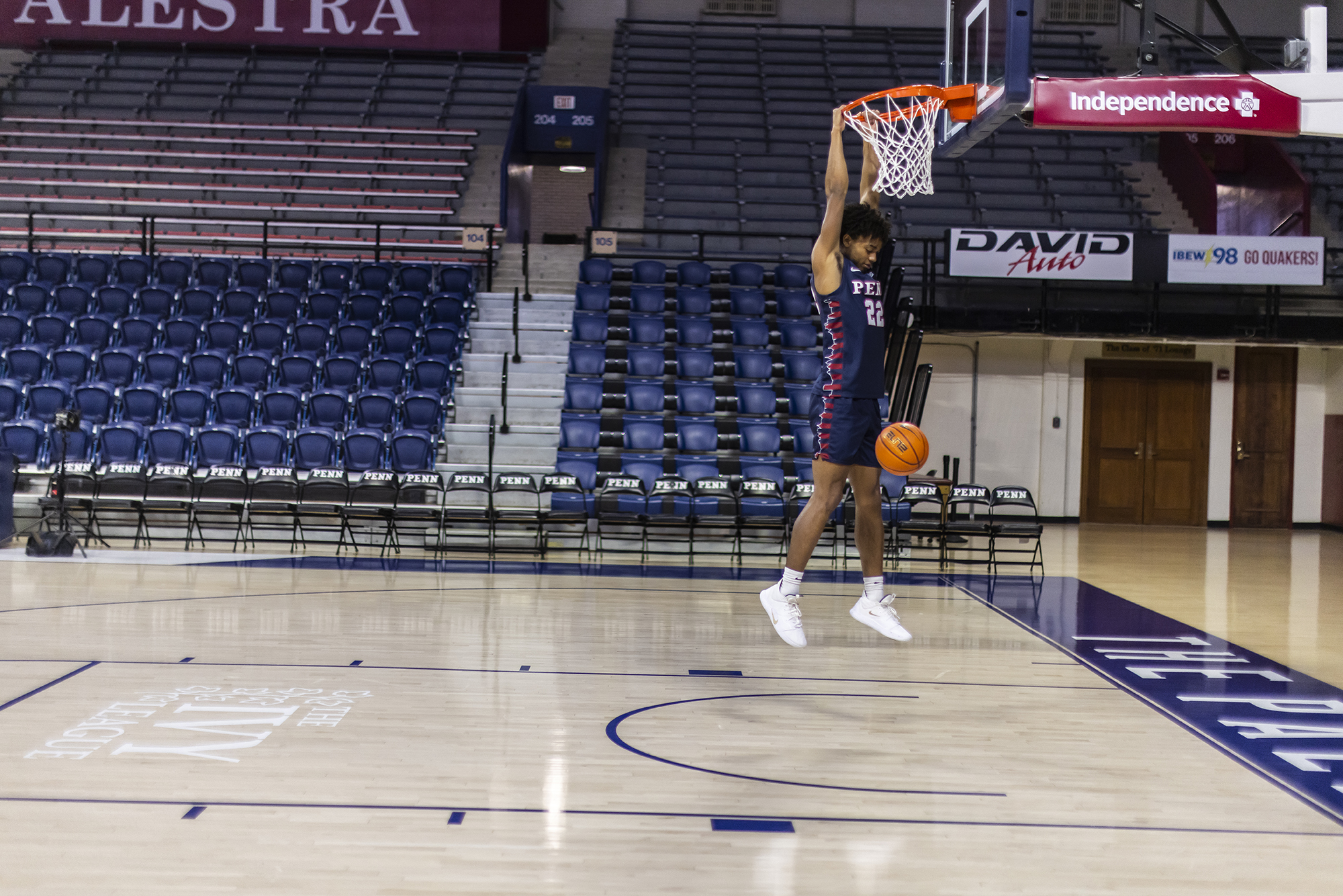 Lucas Monroe dunks with two hands during practice