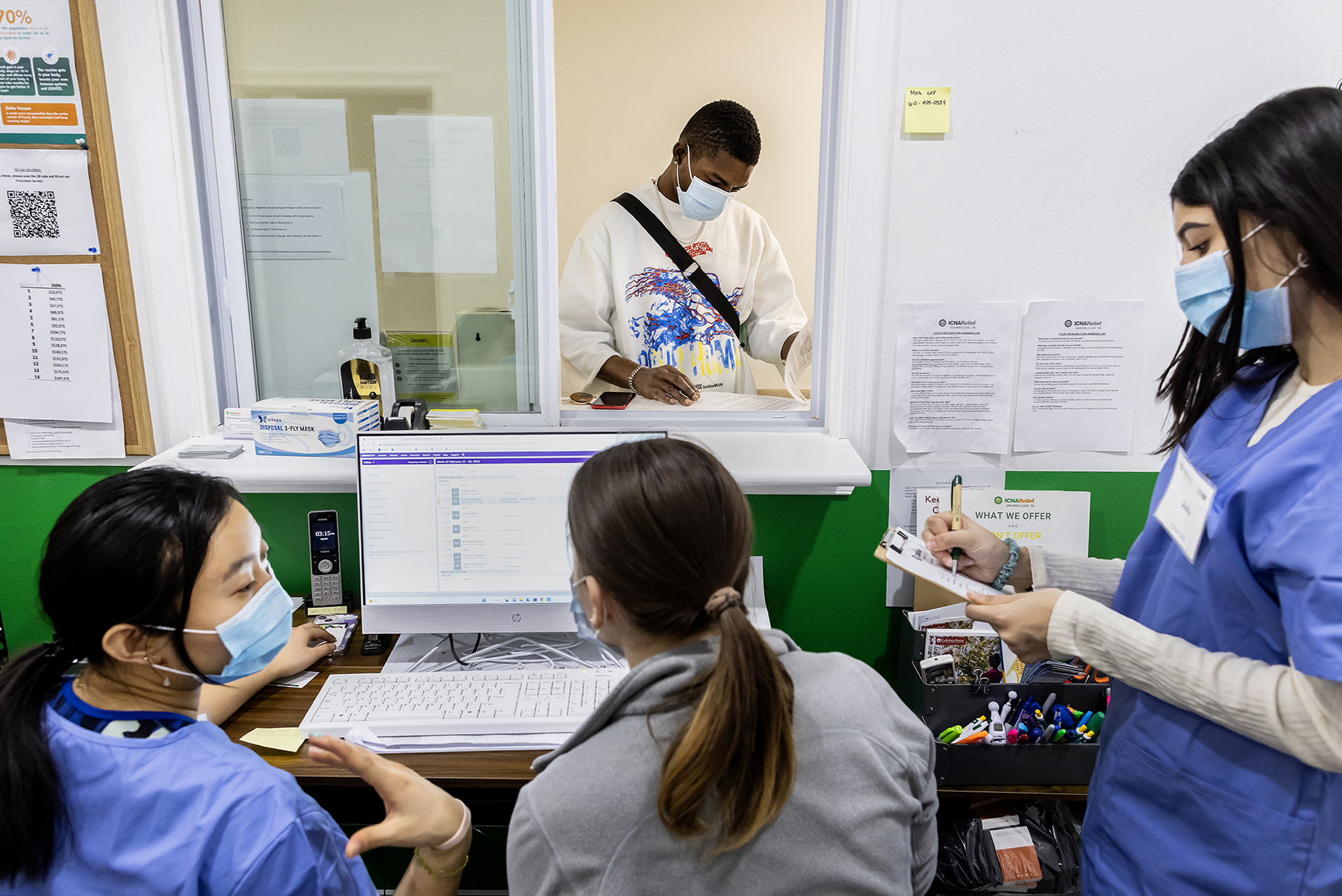 shelter health workers at the front desk