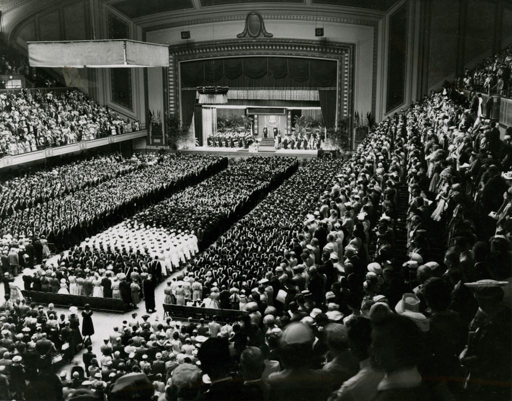 A historical photo of an indoor Penn Commencement ceremony