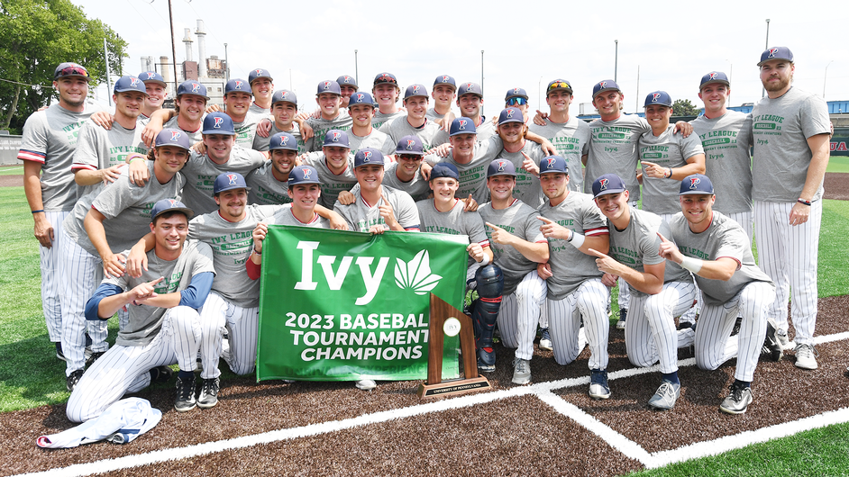 Group photograph of the Penn Men's baseball team holding a championship banner