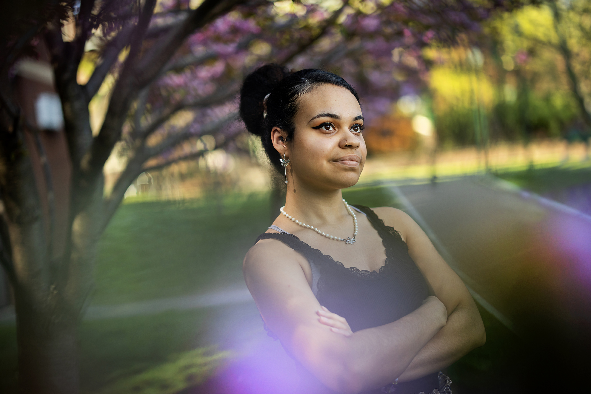 Kelly Garcia-Ramos standing outside under a tree 