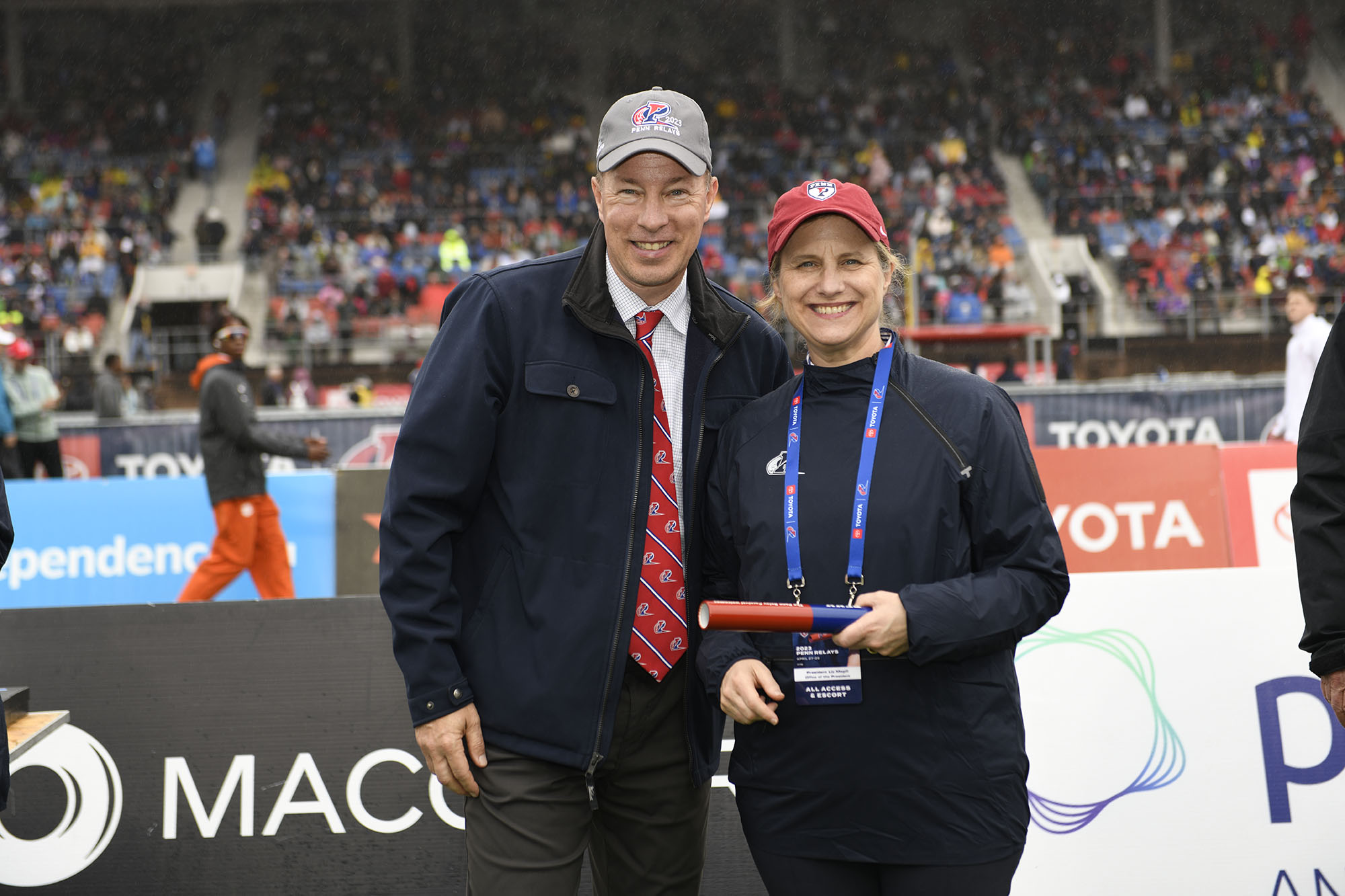 Steve Dolan, the James P. Tuppeny/Betty J. Costanza Director of Track & Field/Cross Country, and President Liz Magill at the Penn Relays.