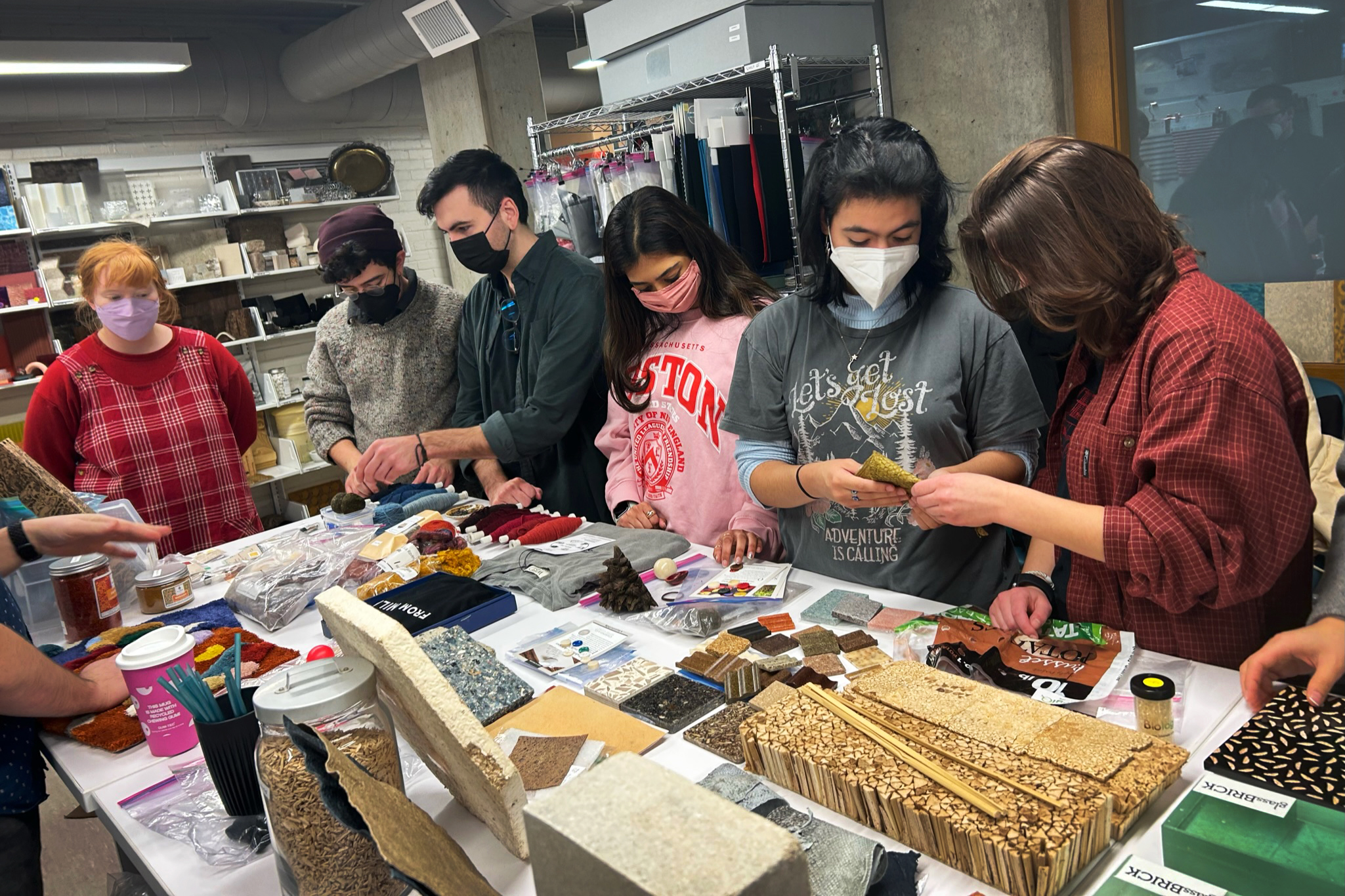 students explore materials used for art