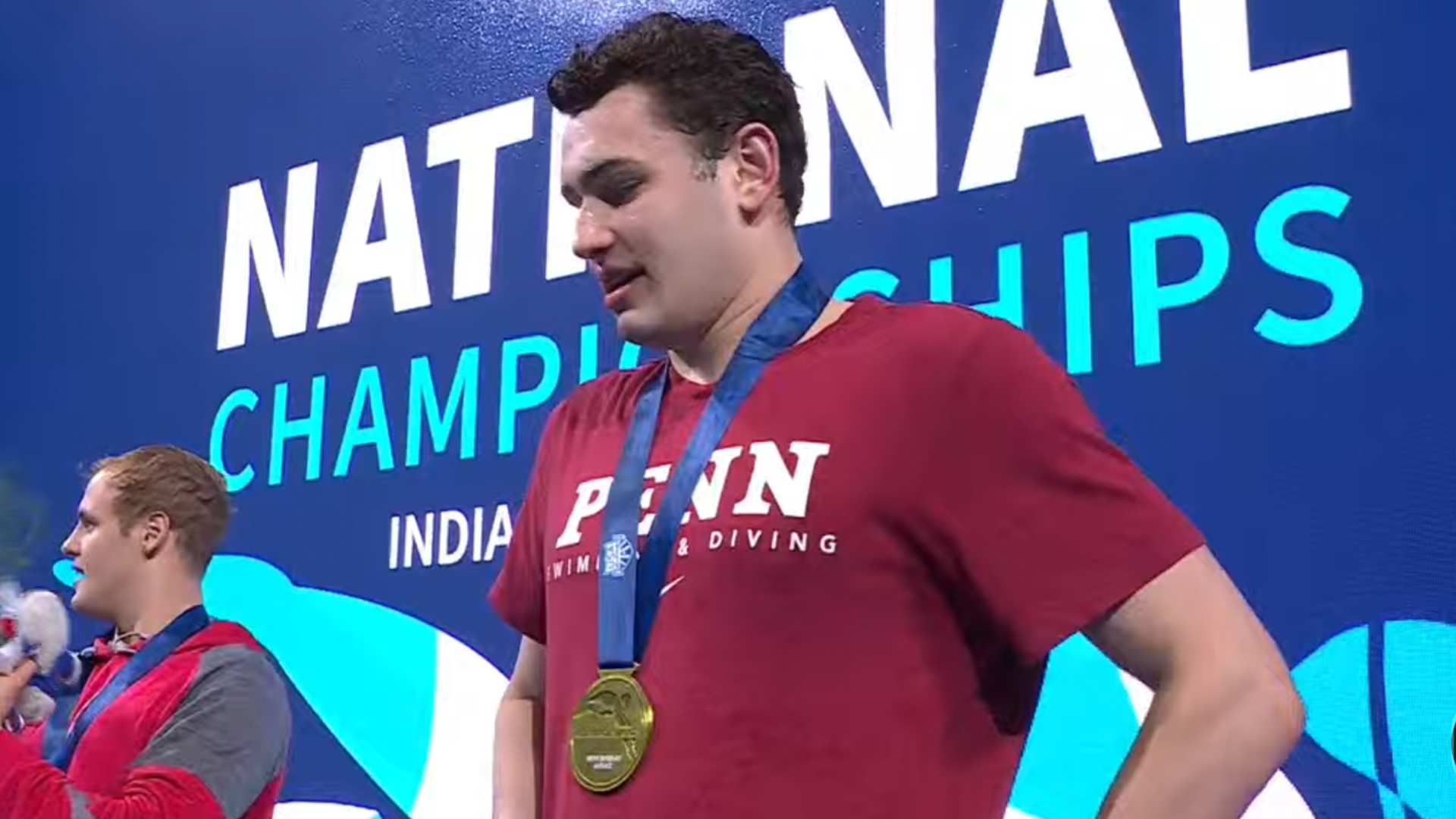 Matt Fallon wearing a medal for winning the 200-meter breaststroke national championship.