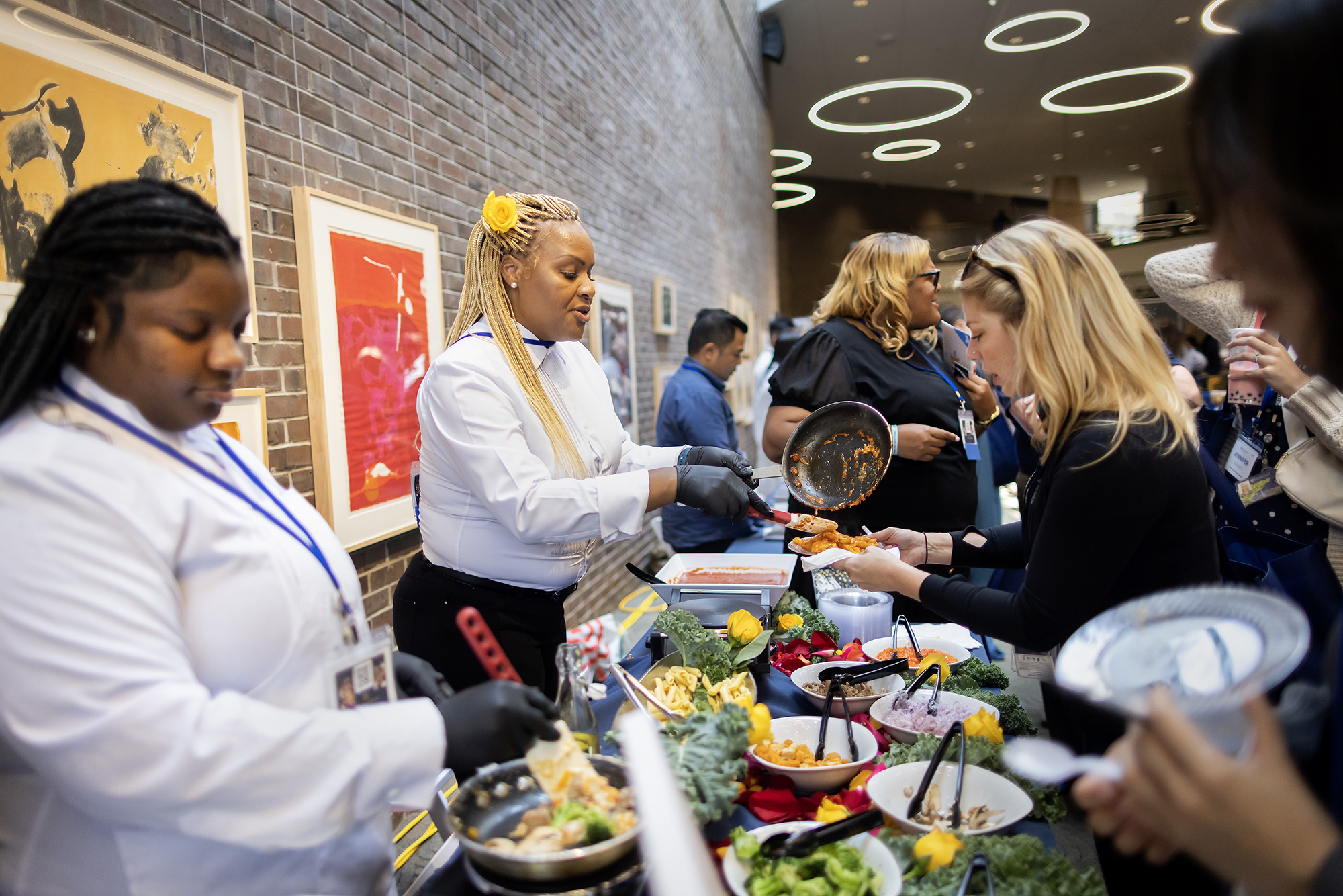 Chefs serving food at the Diversity Supplier Expo.