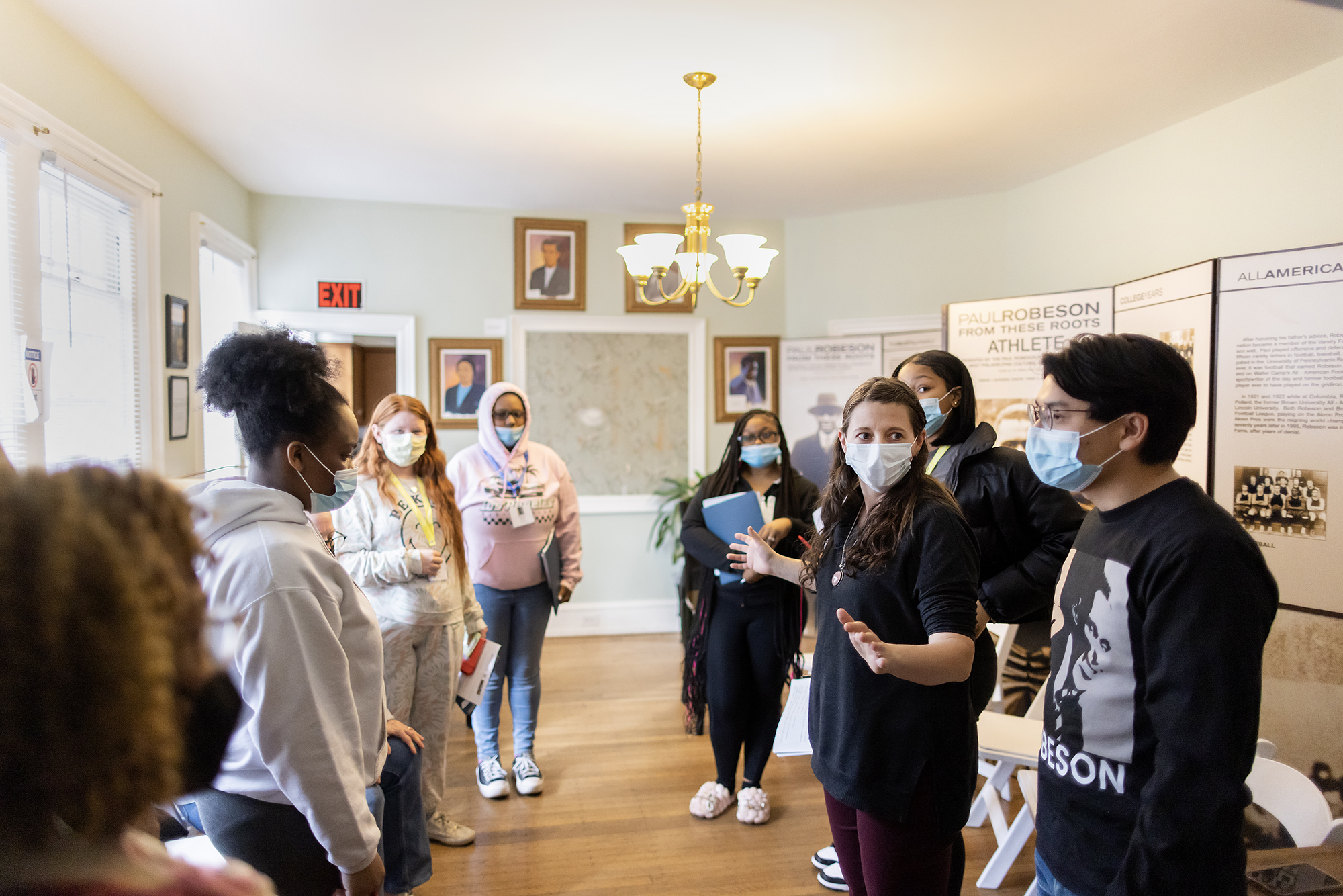 A group of people meeting in the parlour of the Paul Robeson House