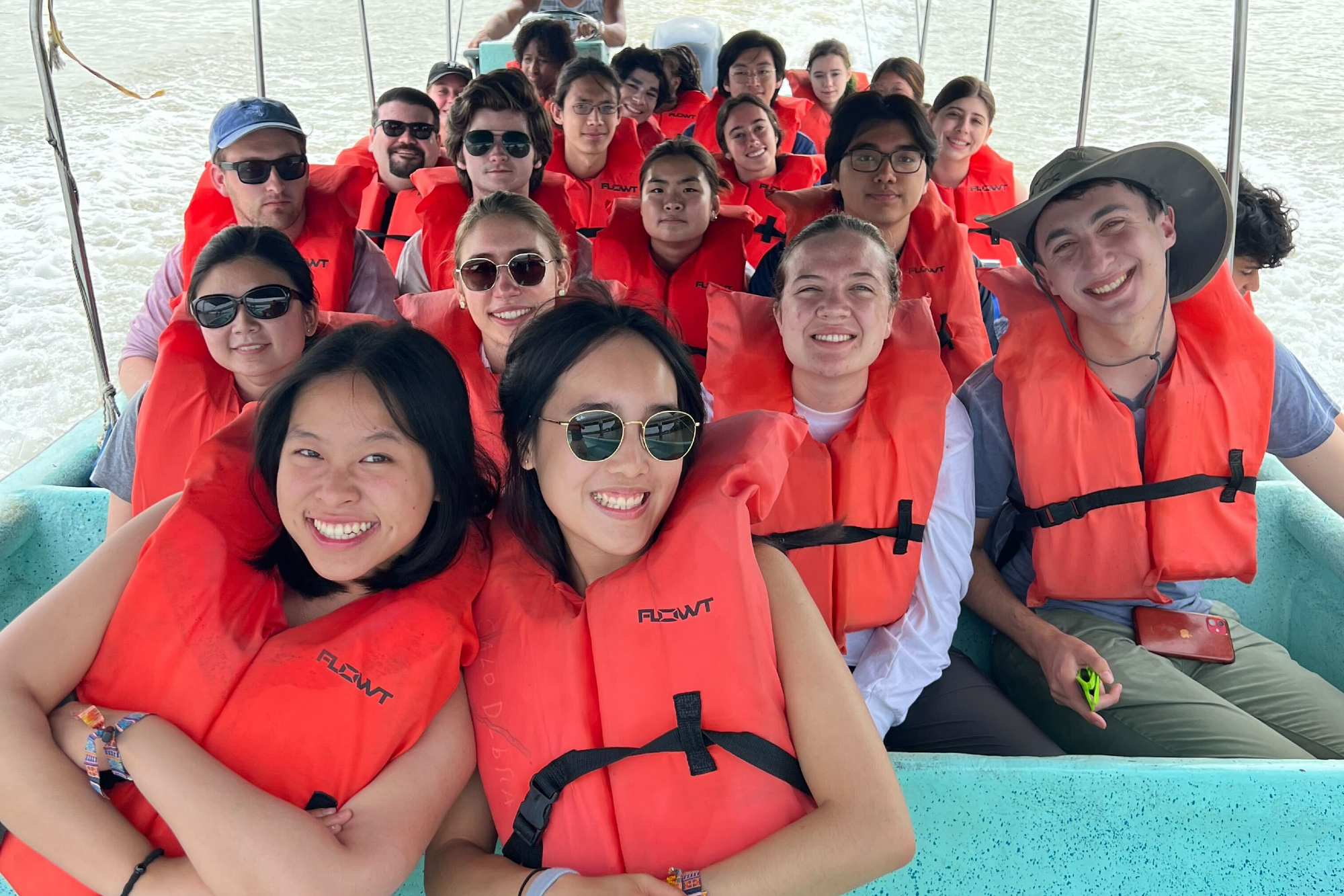 Members of Penn’s Glee Club in life jackets on a boat in Panama.