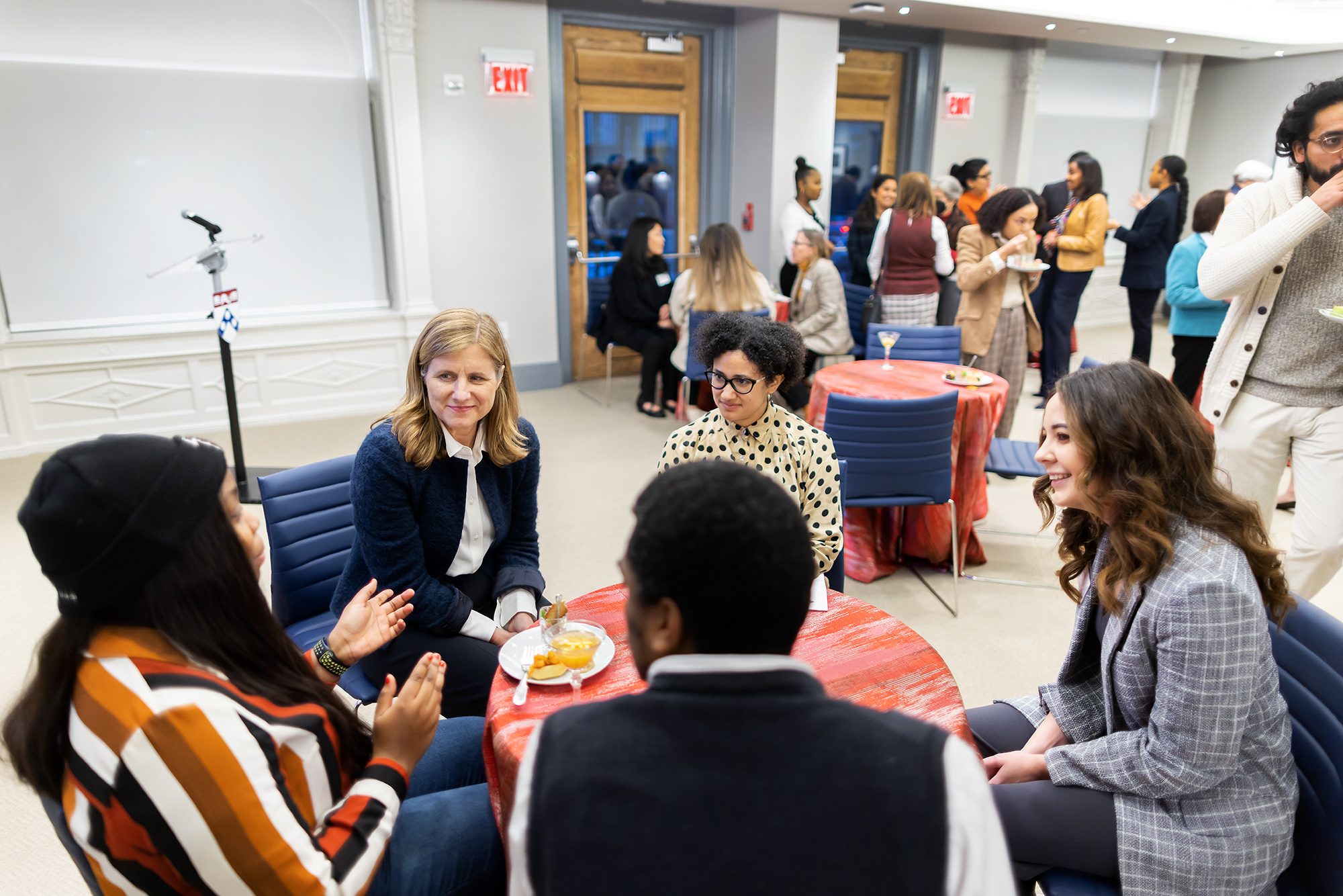 Magill chats with Ph.D. fellows at reception