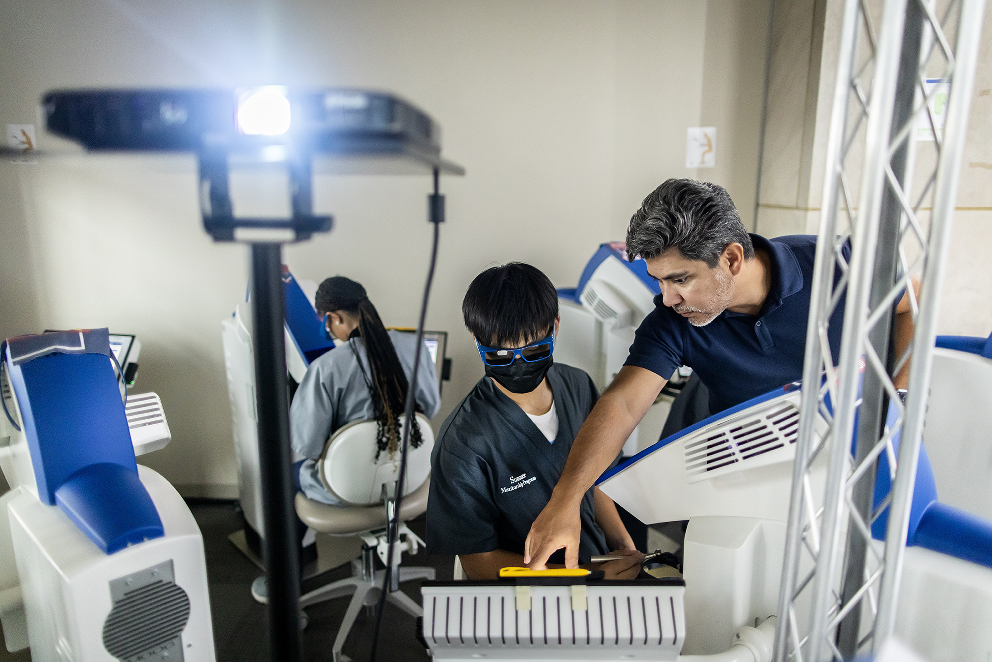 Dr. Oswaldo Nieves (right) and Vincent Dong in the simulation lab.