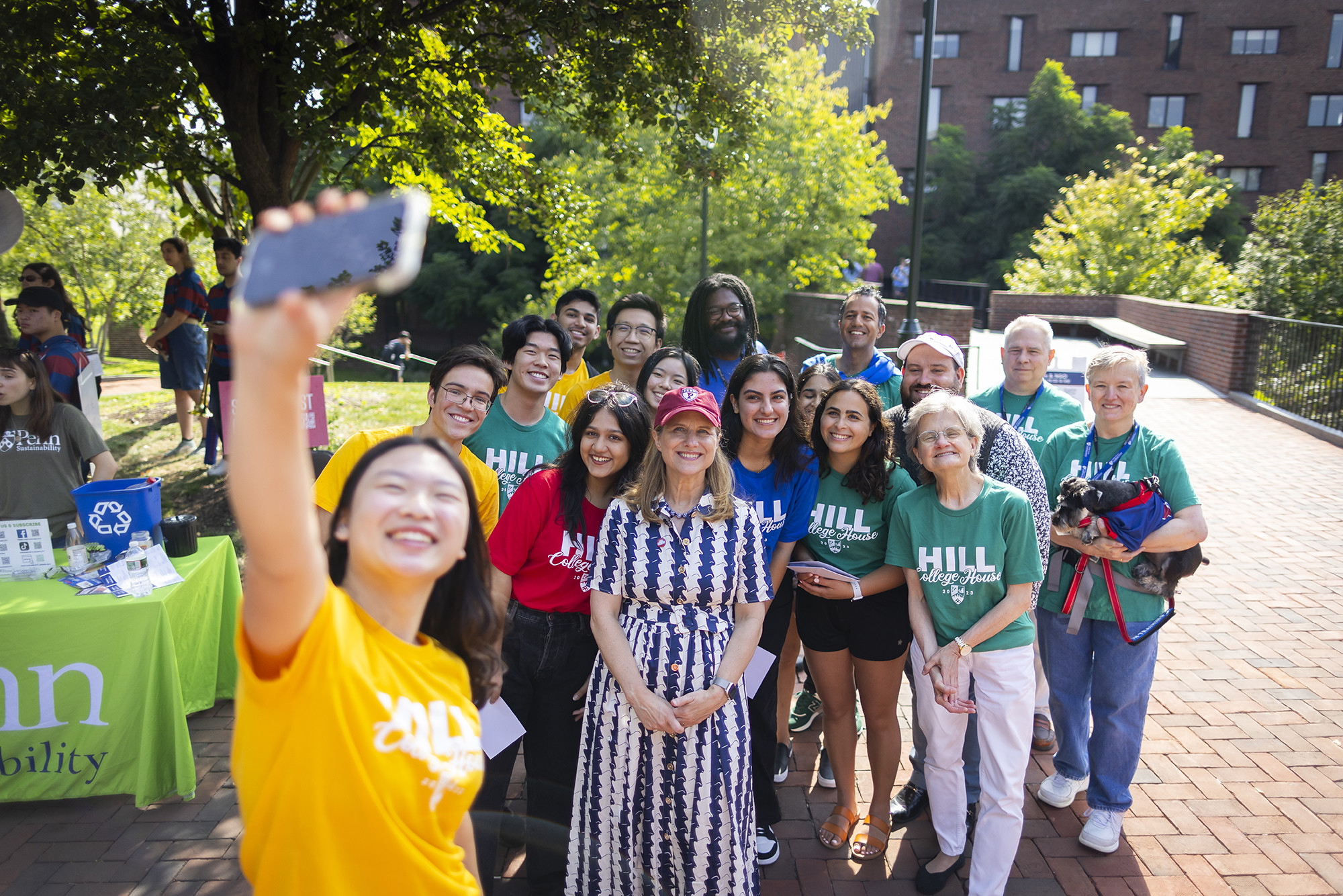 penn president liz magill takes a selfie with house staff during move in