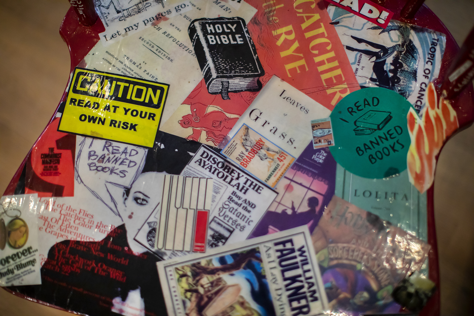 stickers of banned book covers on the Banned Books chair.