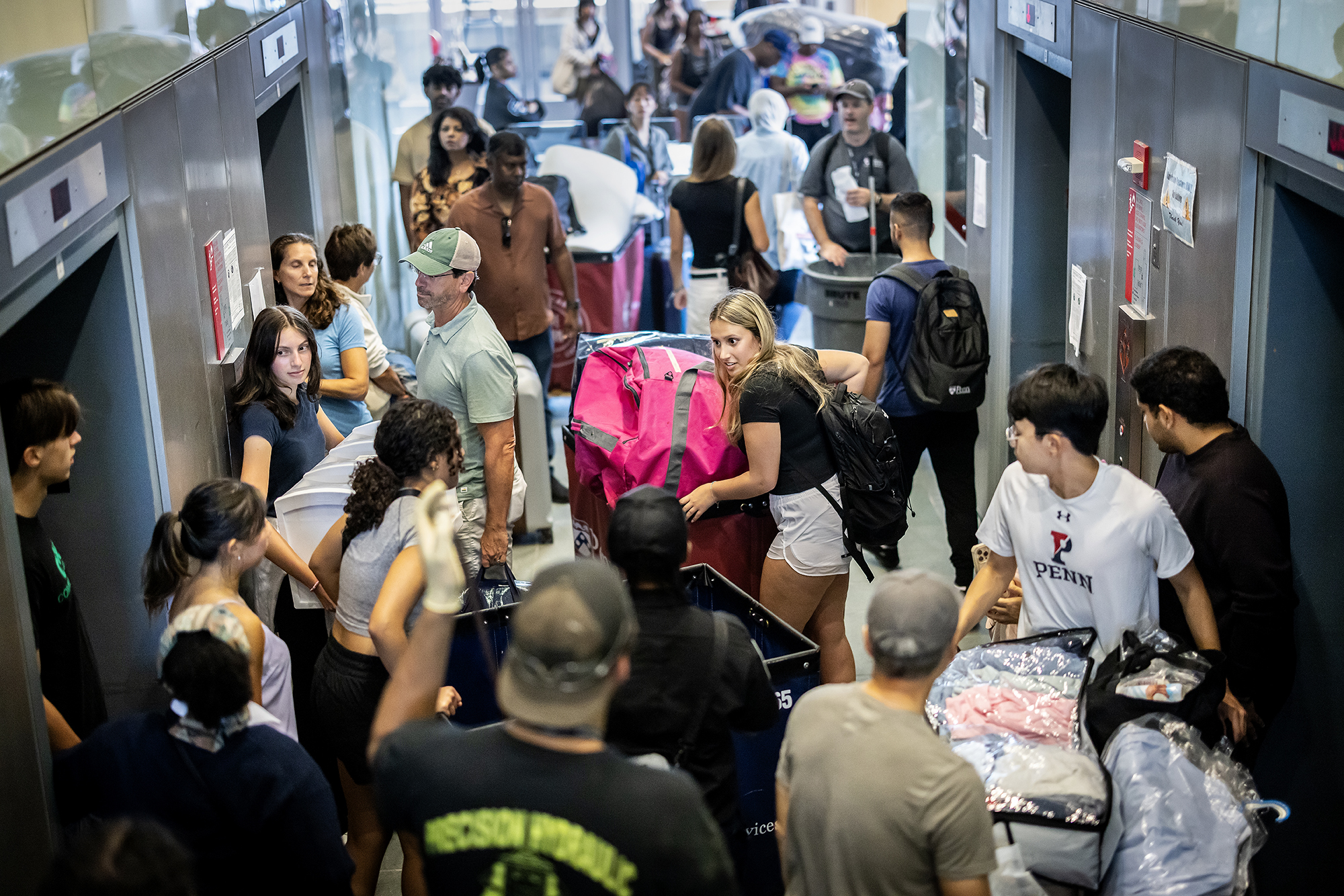 crowds at move-in in elevator lobby