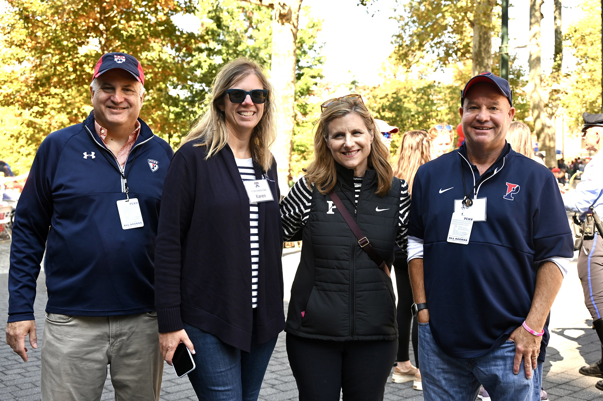 Craig Carnaroli (left) and Liz Magill (second from right) with two others at Penn Friends and Family Day.