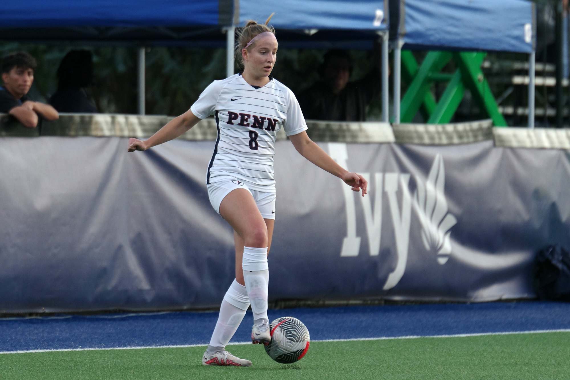 Abbey Cook kicks the ball down the field during a game.