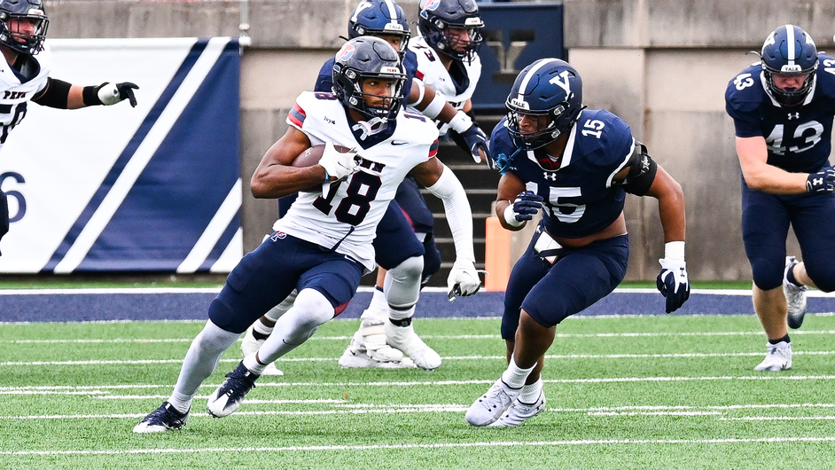 Jared Richardson runs with the ball against Yale in Connecticut.