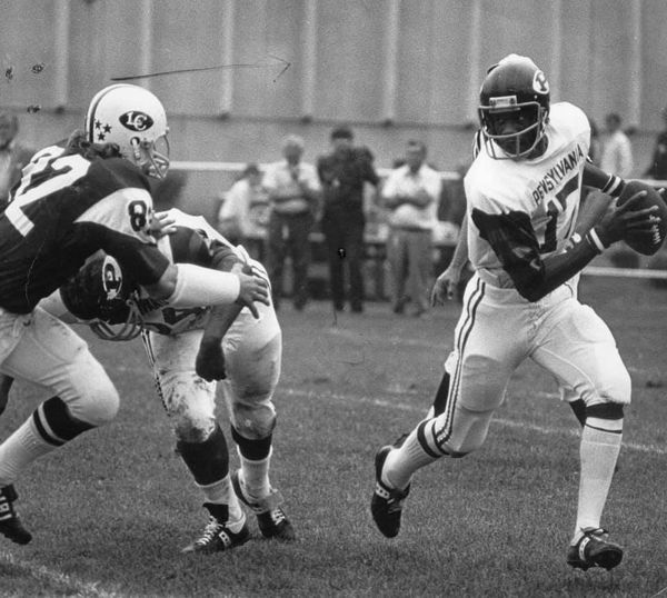 Quarterback Martin Vaughn evades a tackler during a game.