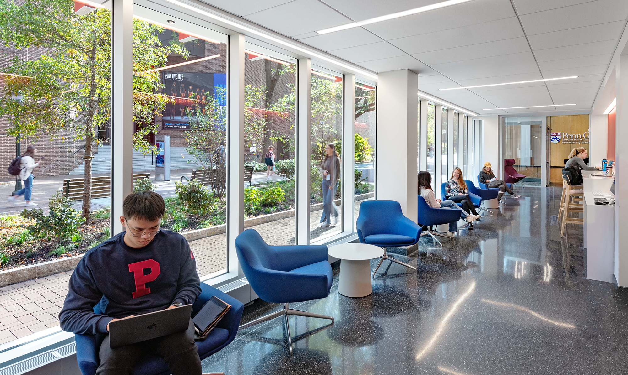 Students sitting in a lounge in a Penn GSE building.