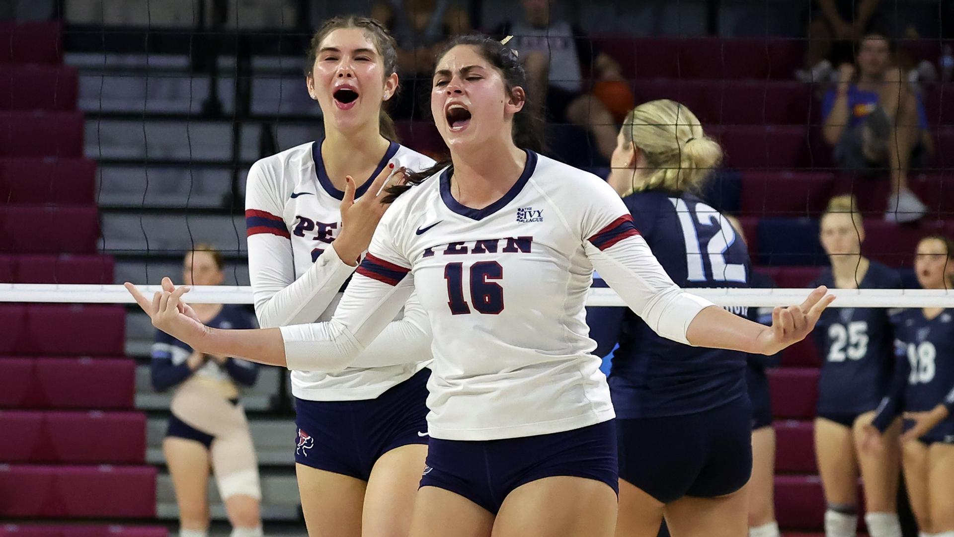 Bella Rittenberg celebrates with a teammate after a big play during a volleyball game.