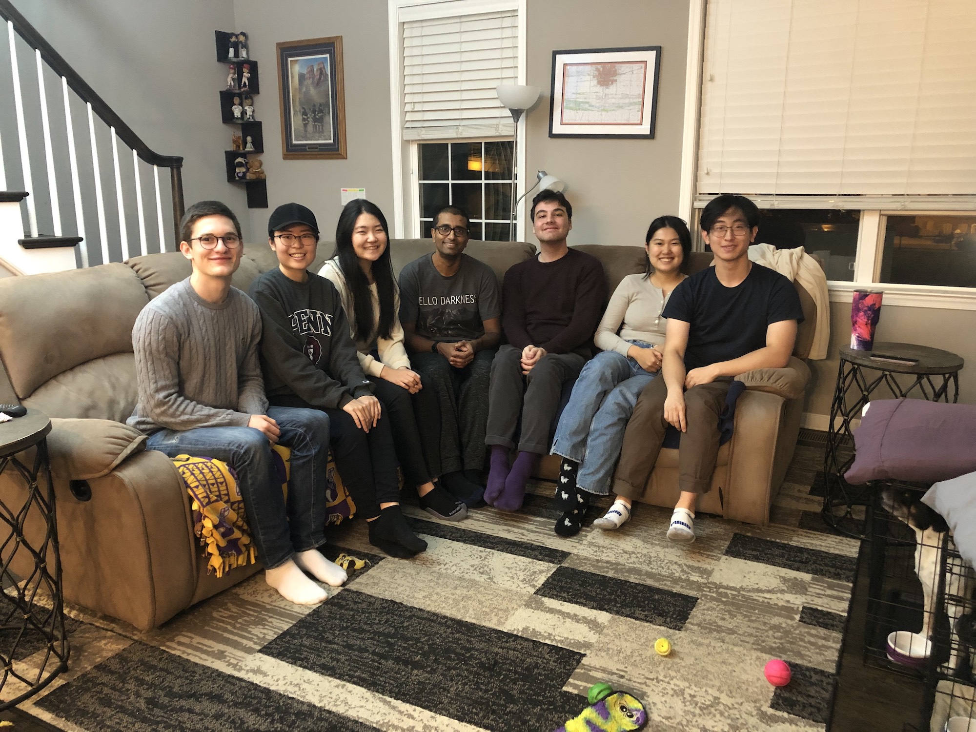 People pose on a couch after Thanksgiving dinner.