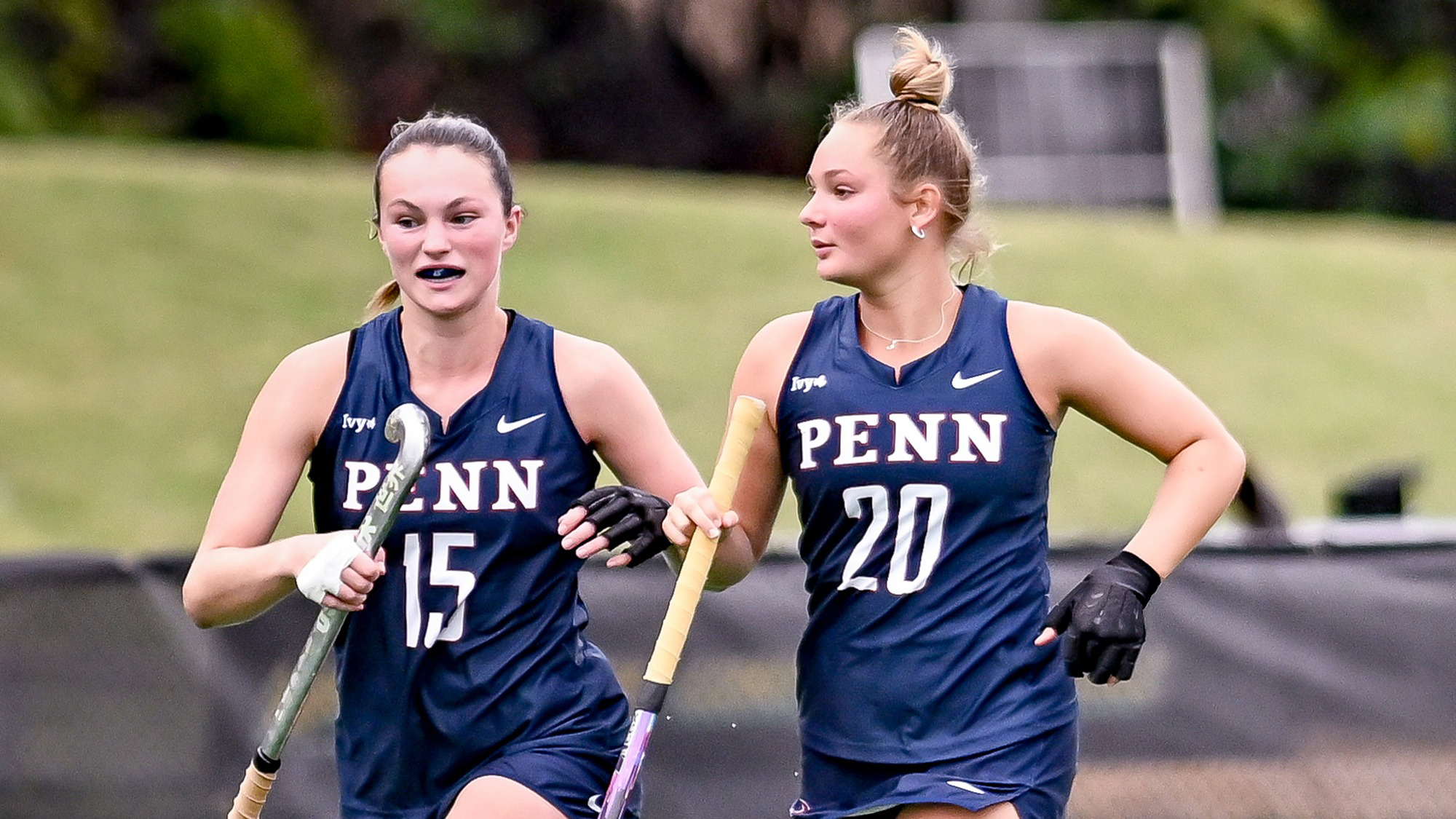 Allison Kuzyk and second-year defender Philine Klas run up the field during a game.