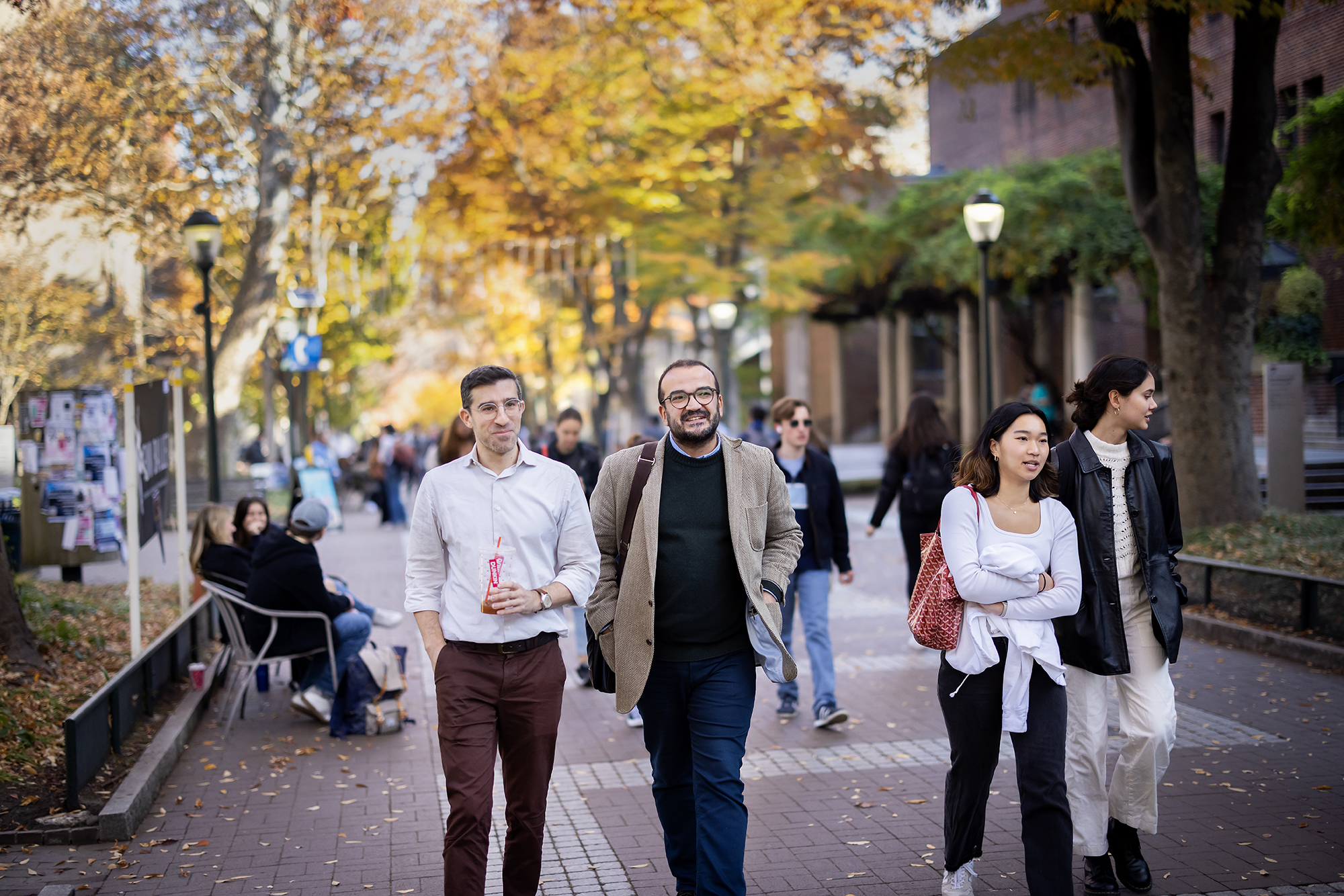 Harun Kucuk and Josh Teplitsky walk together on Penn campus.