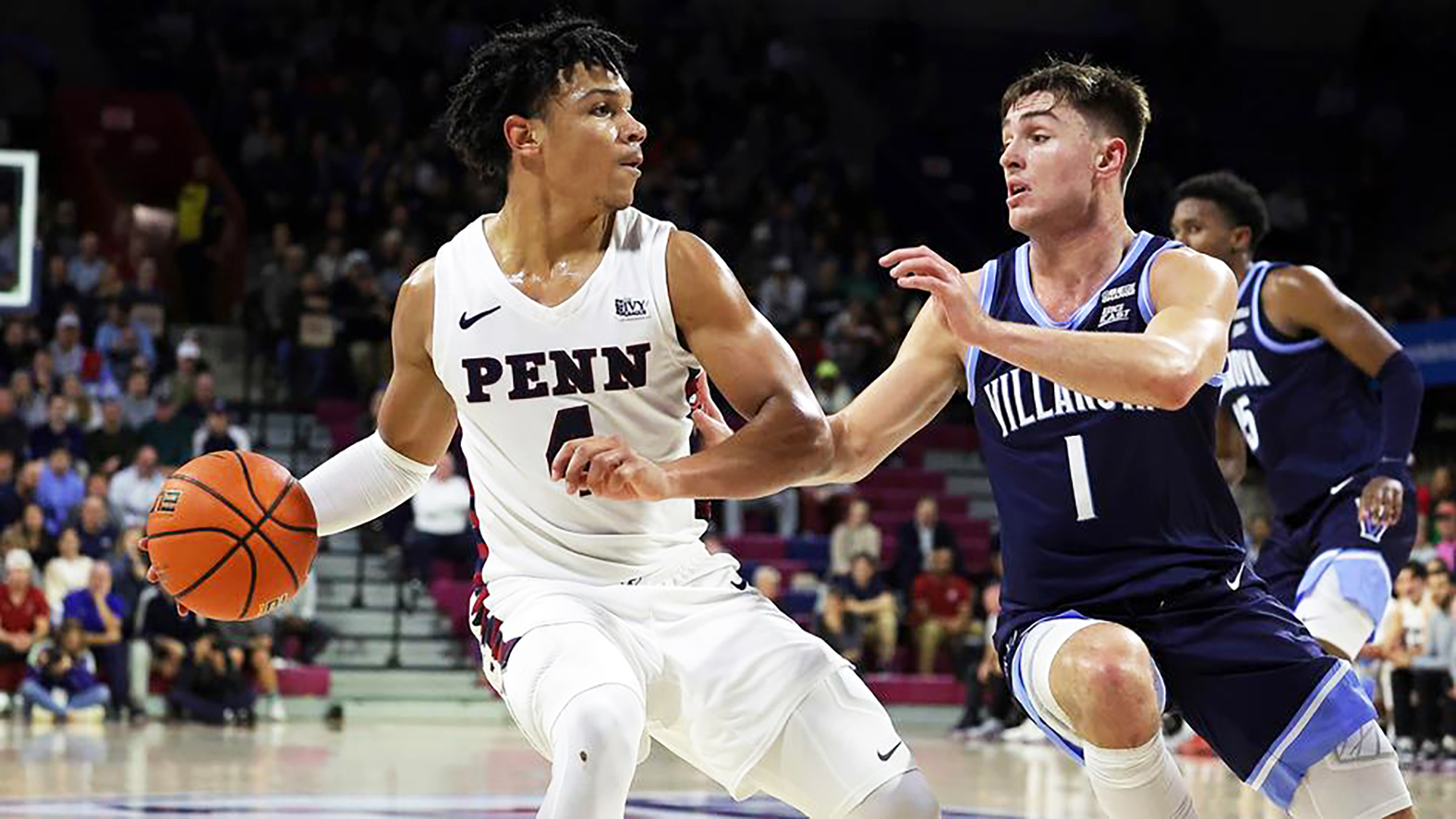 Tyler Perkins makes a move with the ball while defended against Villanova at the Palestra.