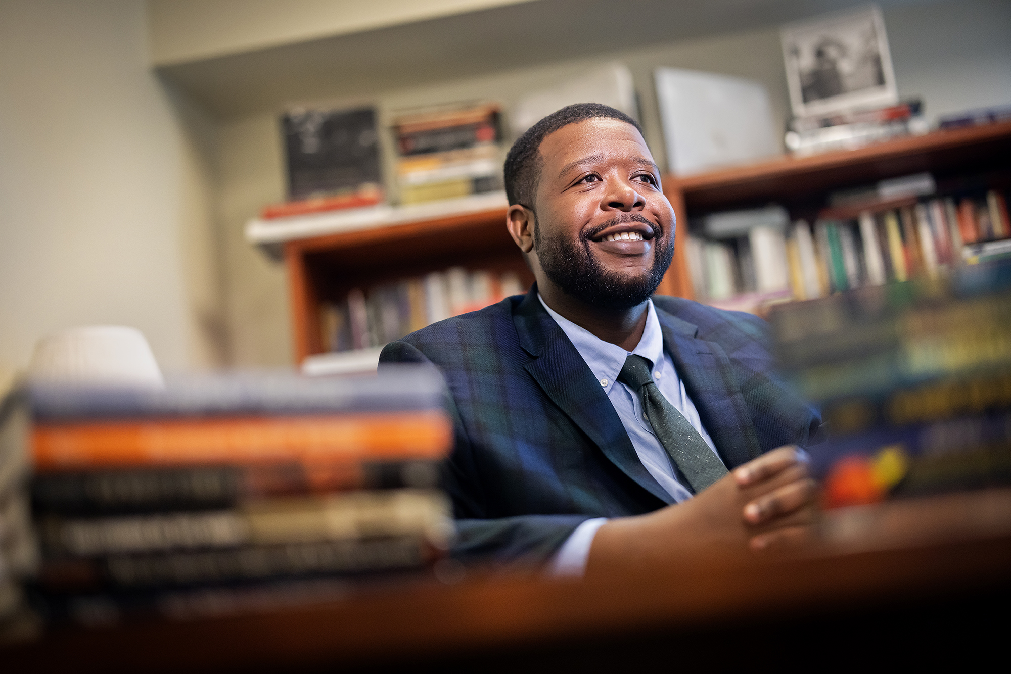 vaughn booker in his office surrounded by books