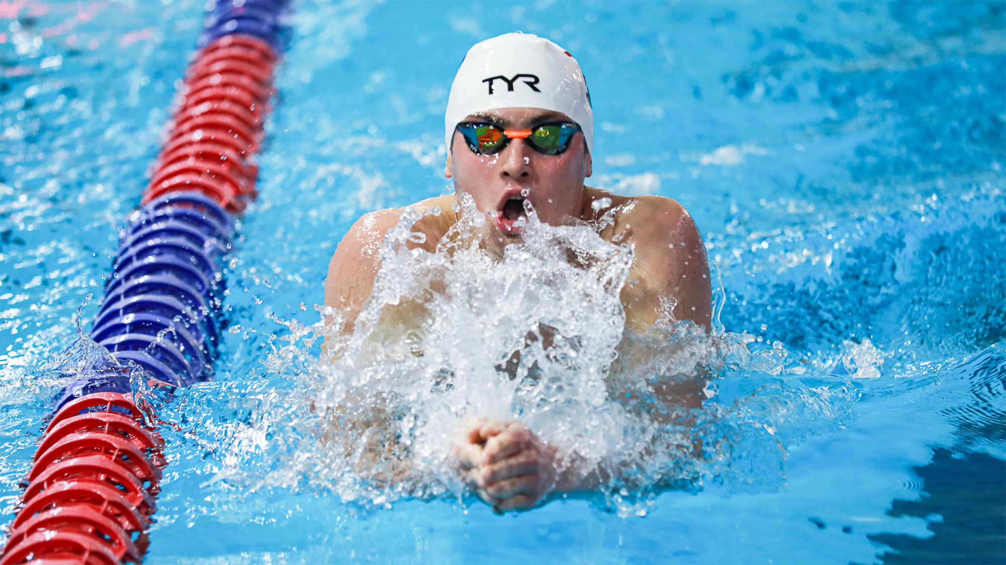Matt Fallon performs the breaststroke during a race.