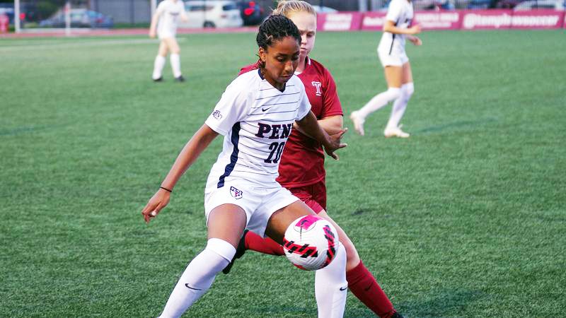 Ginger Fontenot fights for the ball against a Temple player during a home game.