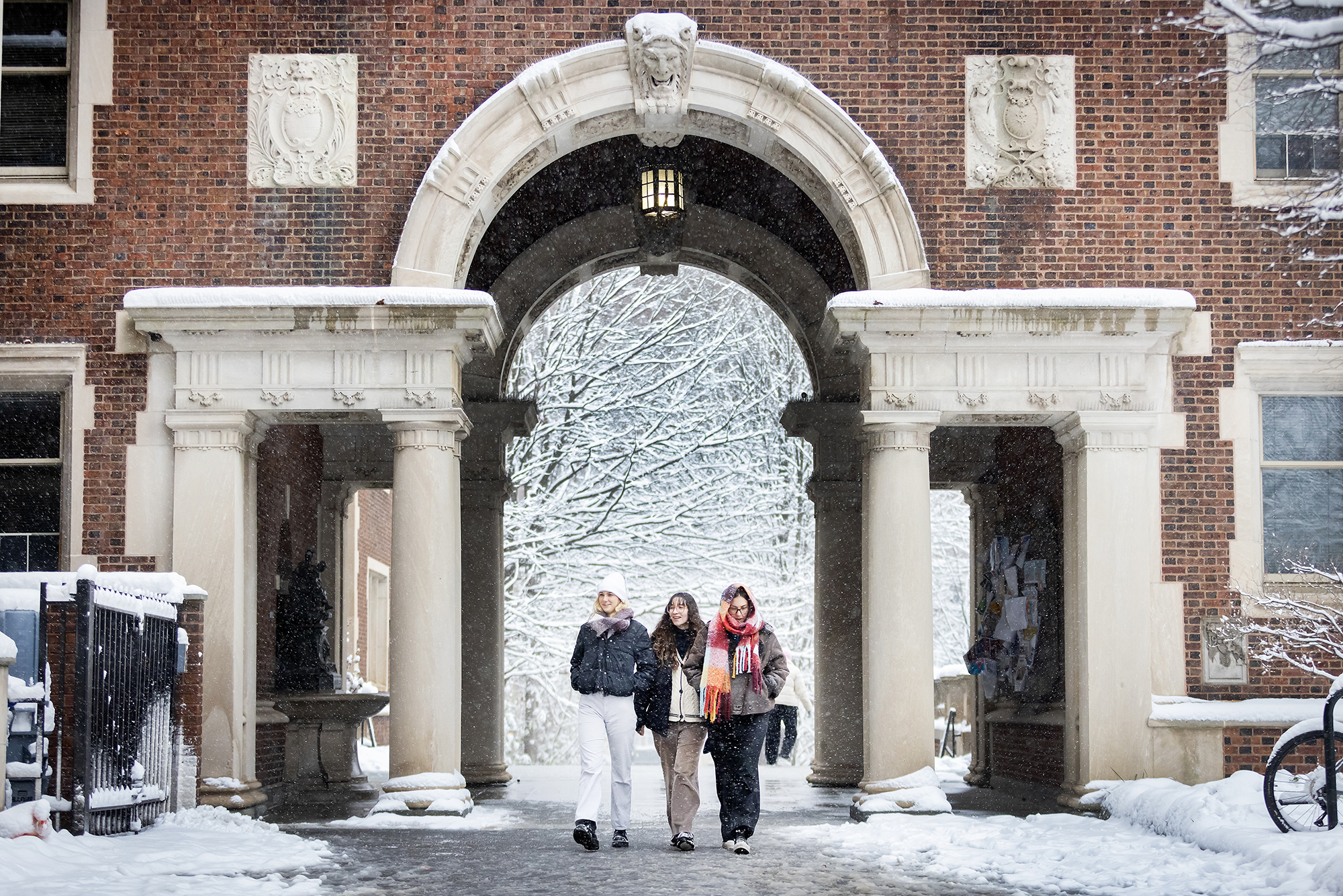 students walking in the quad during snow