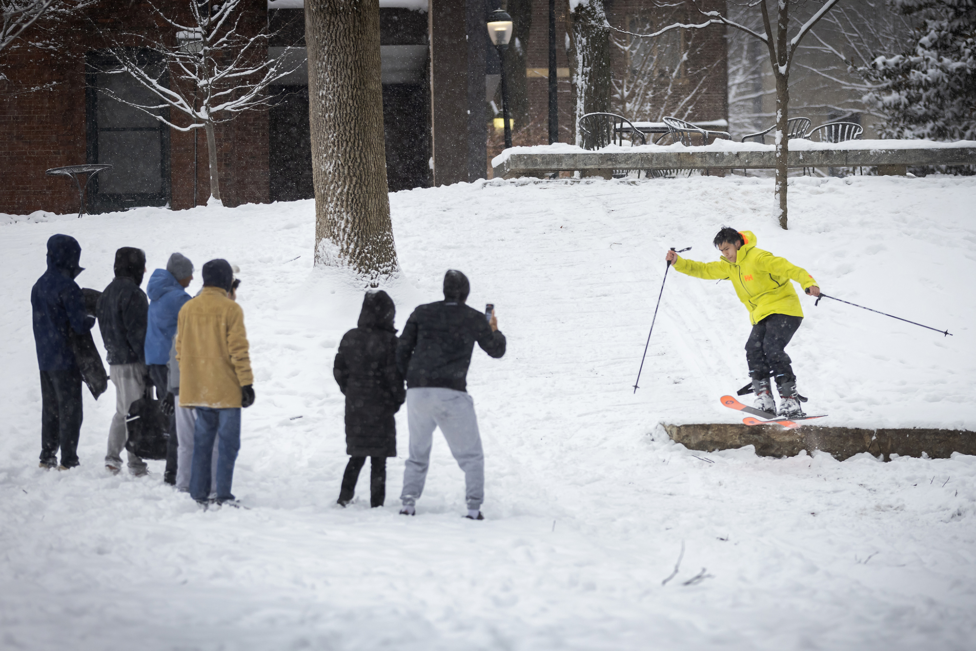 a student skiis on collage green