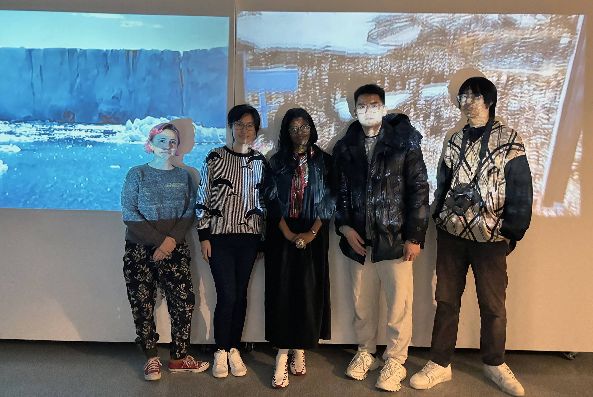 Sosena Solomon and students at a film screening in a gallery.