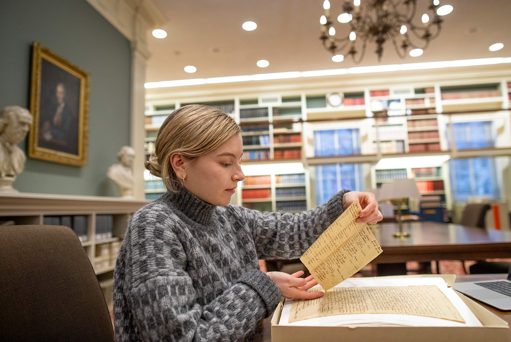 Molly Leech looks at historic documents in At the American Philosophical Society in Philadelphia.