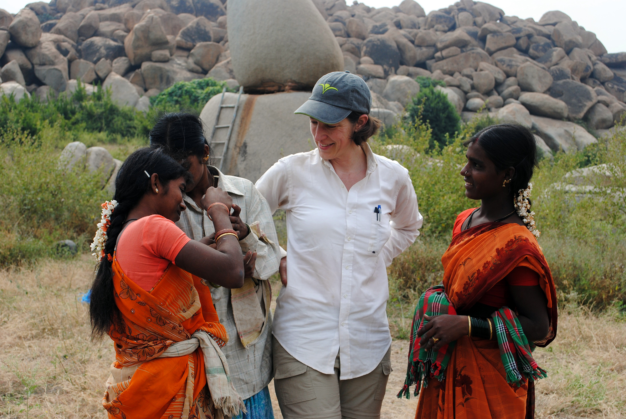 Kathleen Morrison and three people in India.