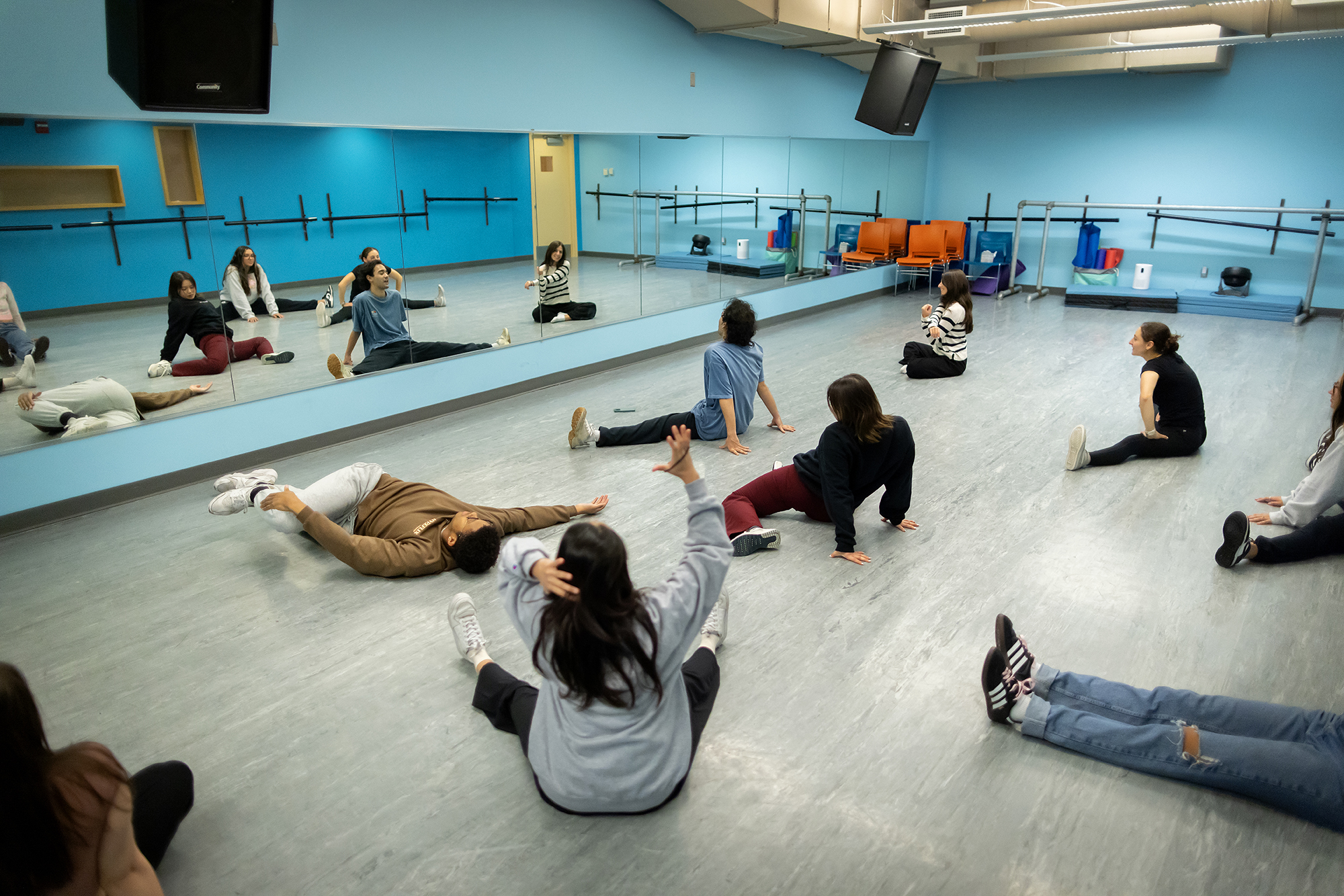 Members of one of Penn’s dance troupes stretching in a studio.