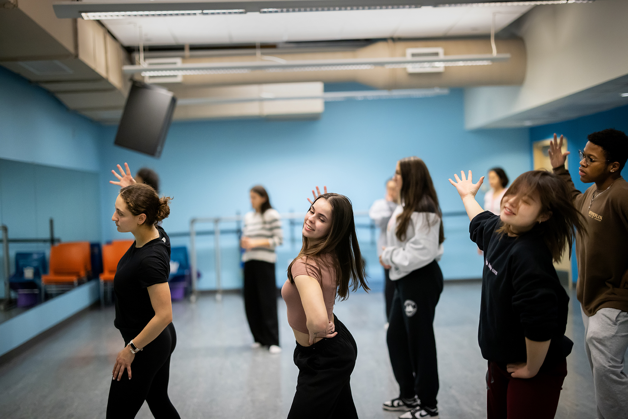 Members of a Penn performing arts group rehearsing in a studio.
