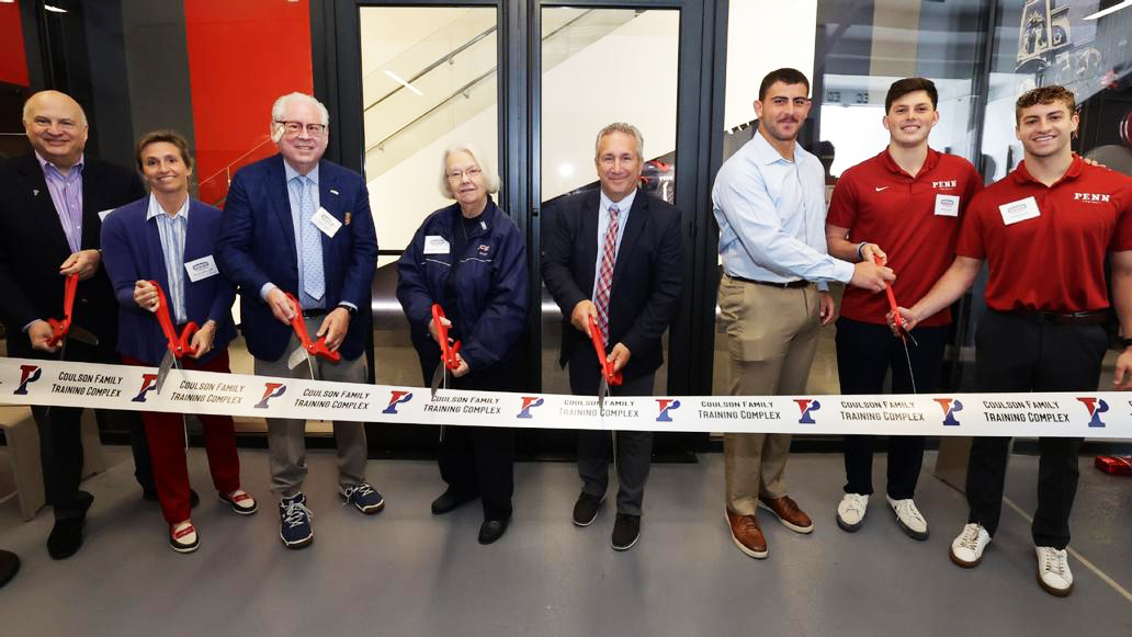 Penn coaches and administrators cut the ribbon for the Coulson Family Training Complex.